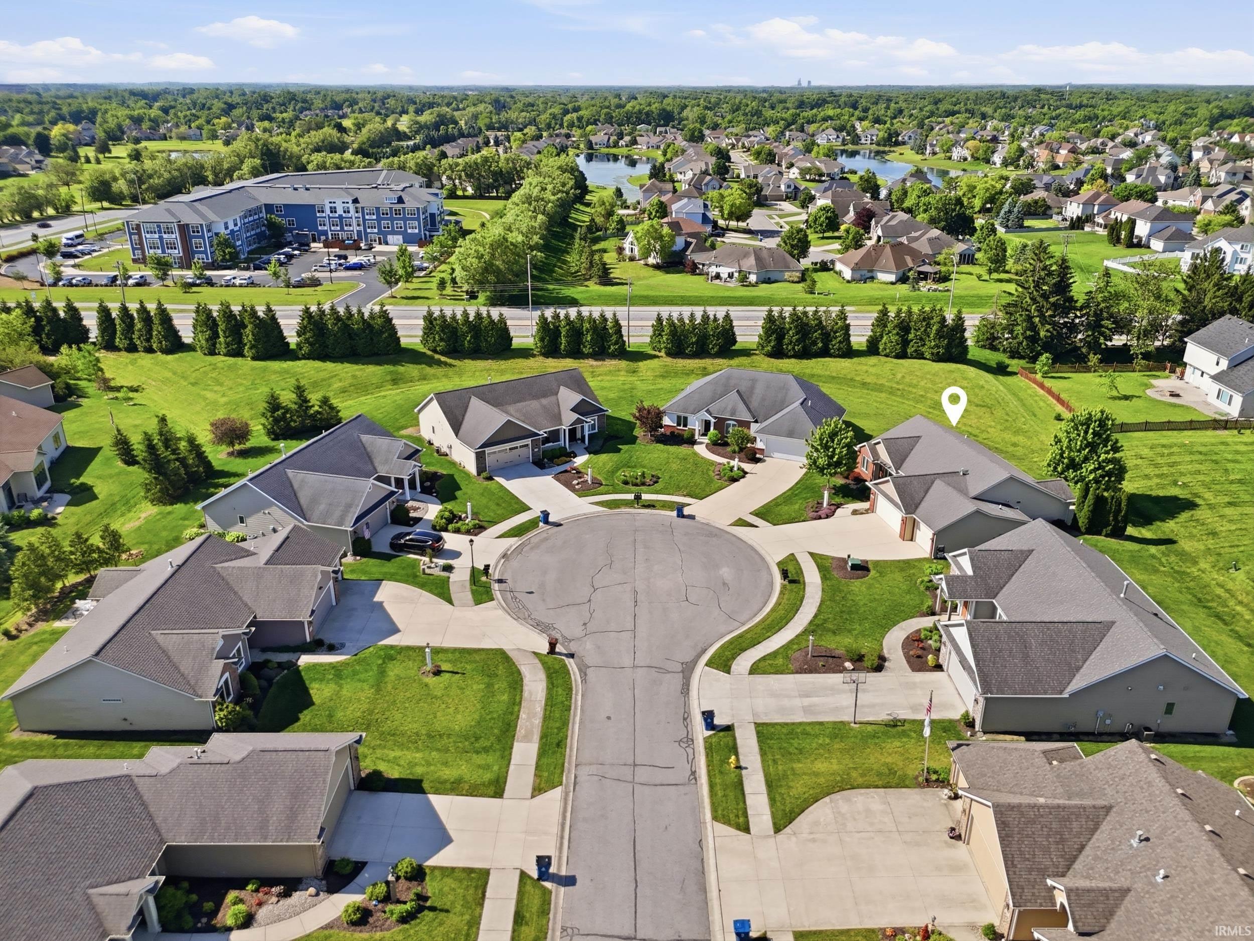 Residential cul-de-sac with manicured lawns and mature trees
