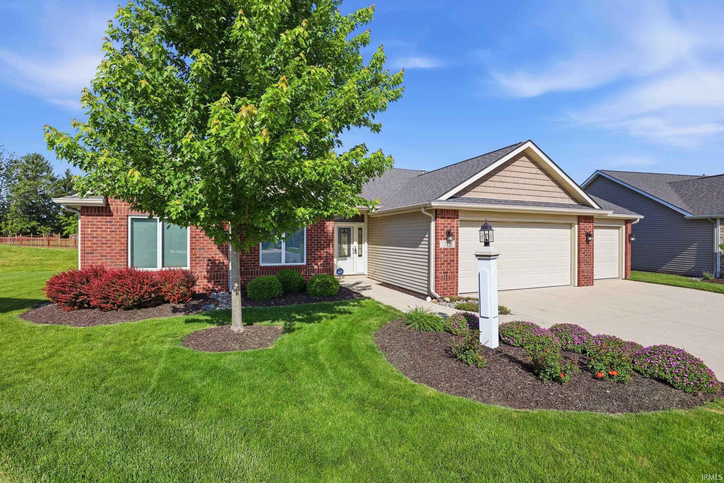 Brick and siding exterior with a two-car garage