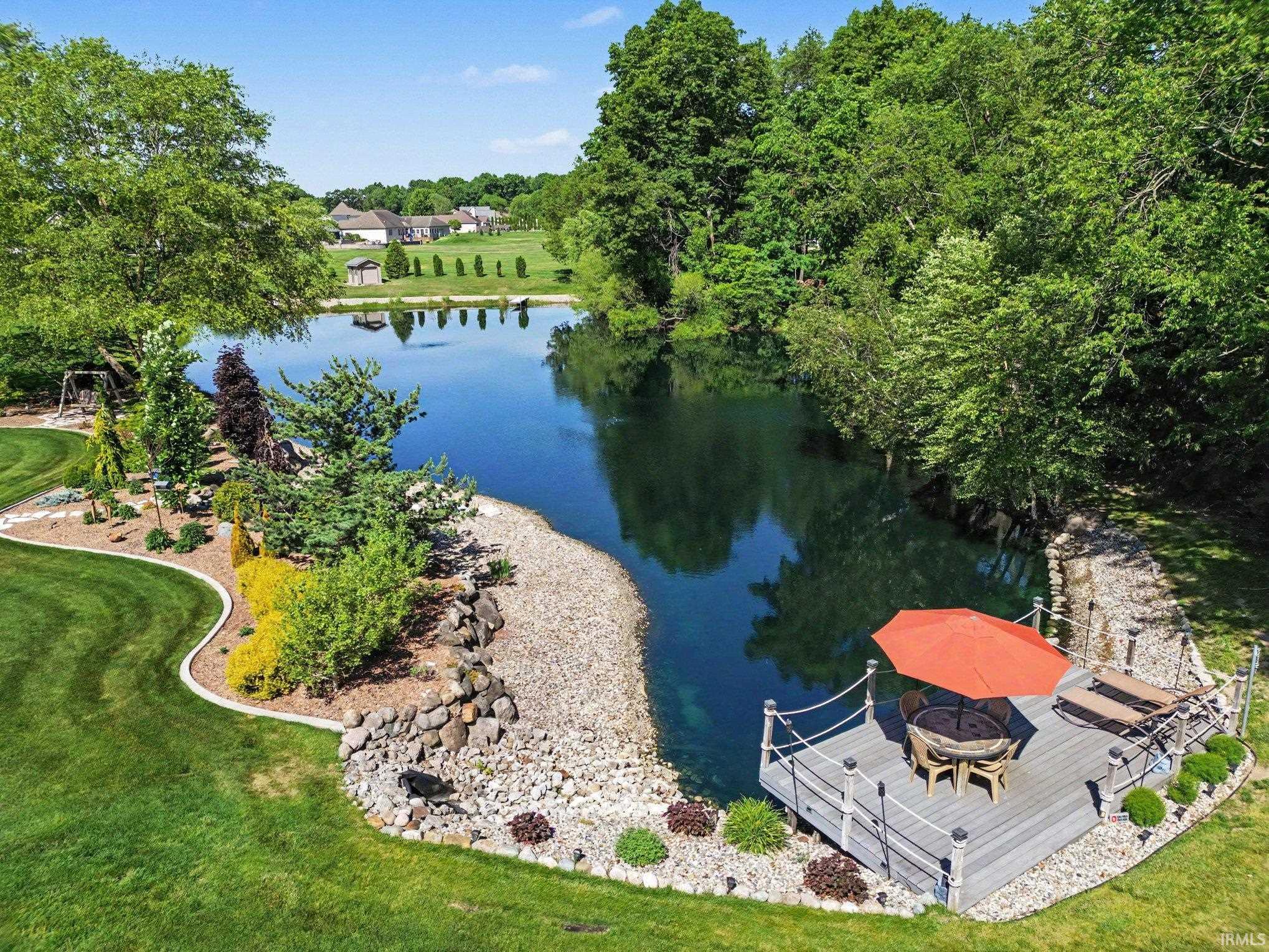 Waterfront dock with composite decking, rope railing, and integrated lighting