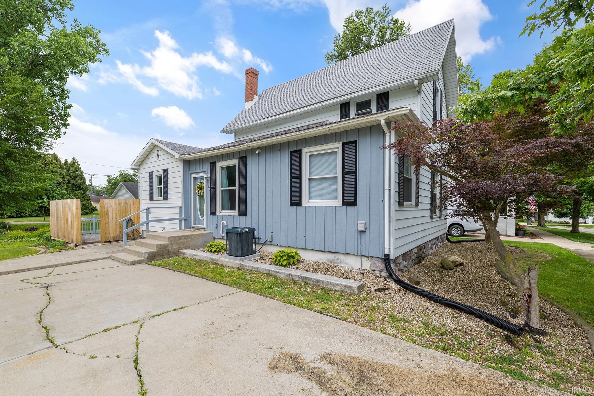 Two-story exterior with light blue siding and white trim