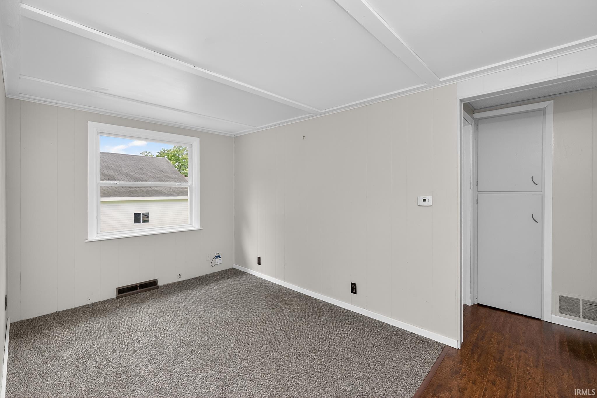 Light gray walls paired with a plush gray carpet