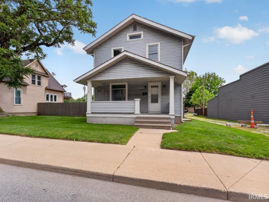 Gray siding exterior with white trim