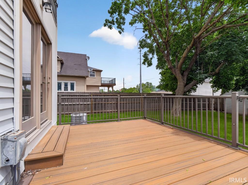 Expansive deck with composite wood-finish decking and metal railings