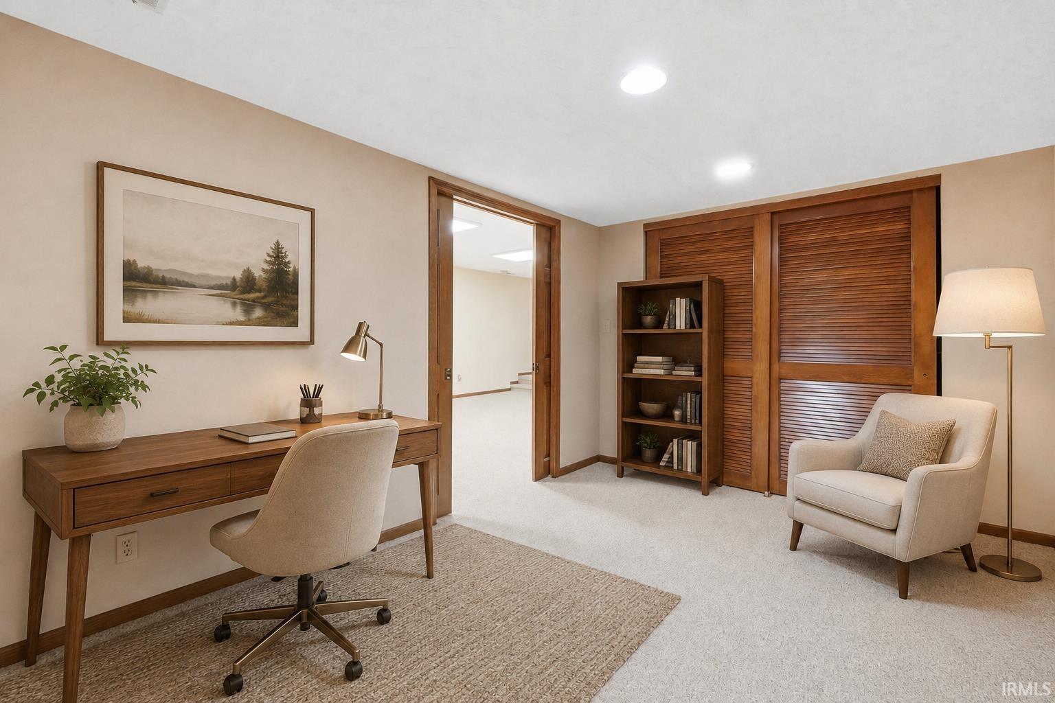 Recessed ceiling lighting, light-toned wall paint, louvered wood sliding doors, and light-toned carpeting