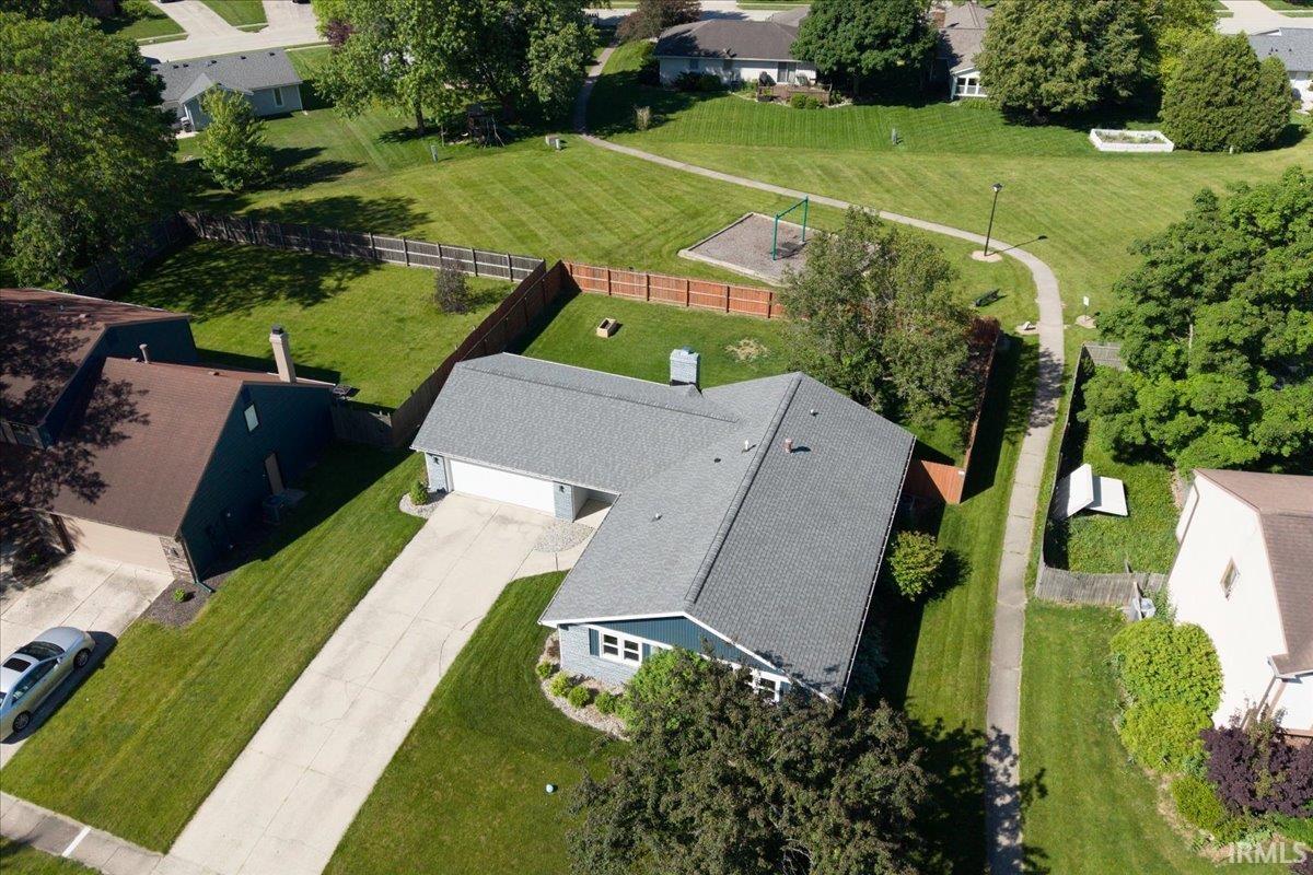 Single-story residence featuring a gray shingle roof, blue siding, and white trim