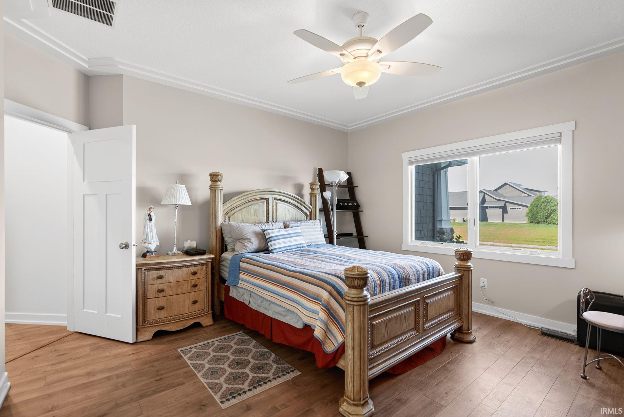 Wood-finish flooring with neutral wall tones and white trim
