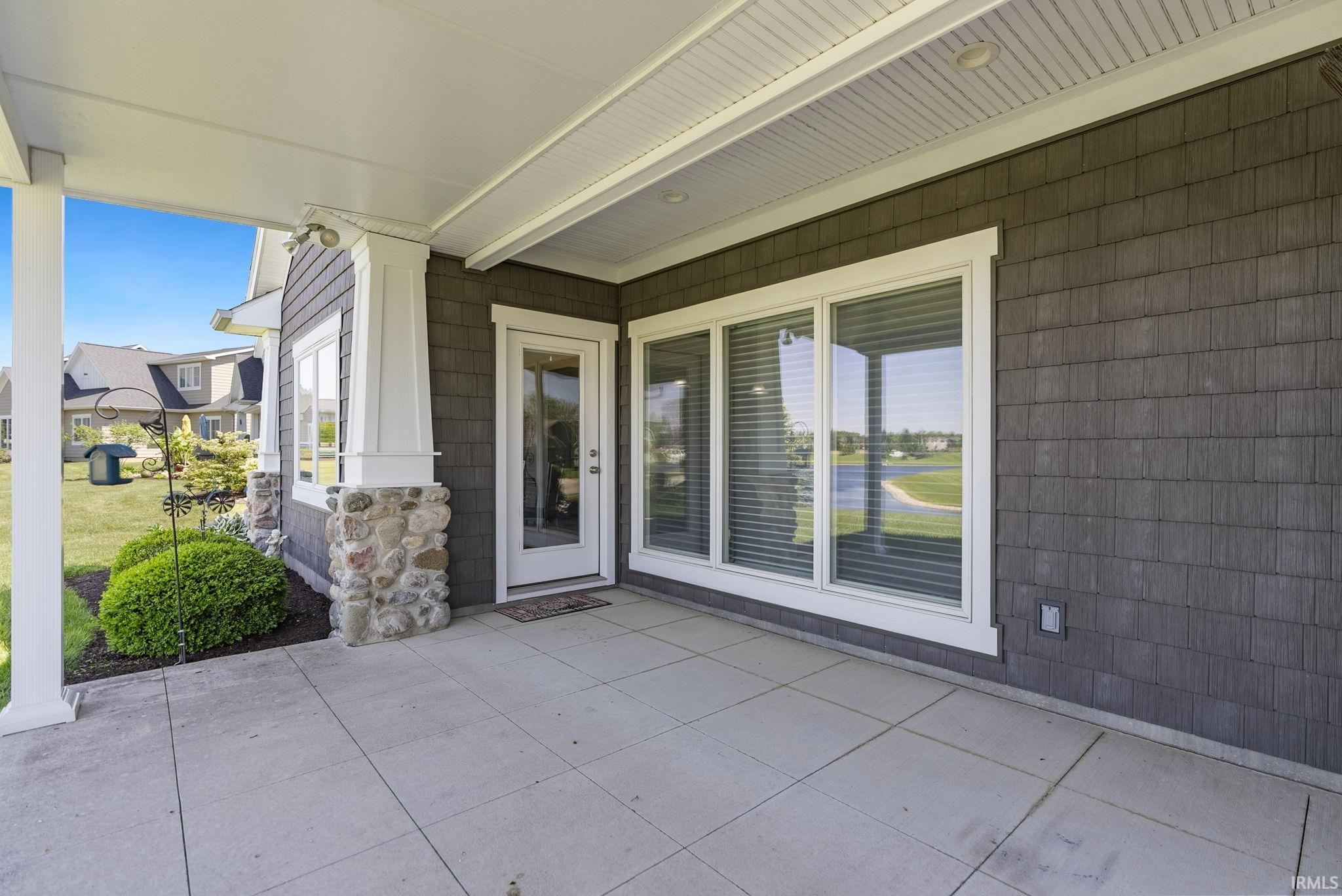 Covered patio featuring concrete flooring and a white paneled ceiling