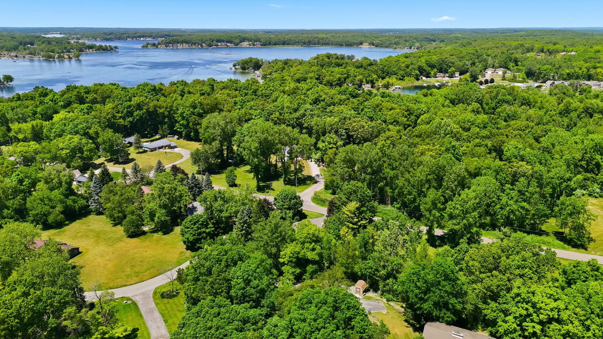 Expansive wooded landscape featuring mature trees and verdant foliage