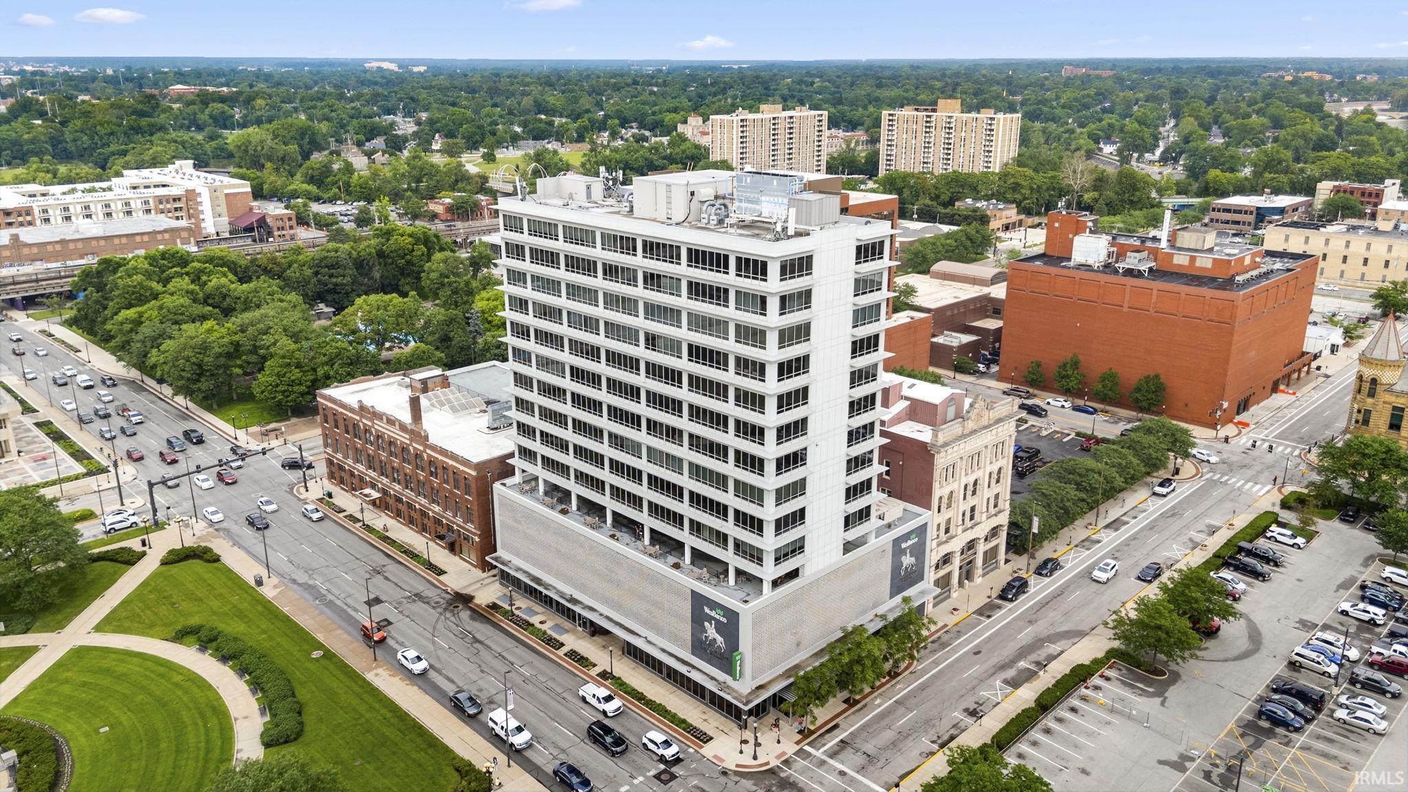 Mid-rise commercial building featuring a multi-story facade with expansive windows