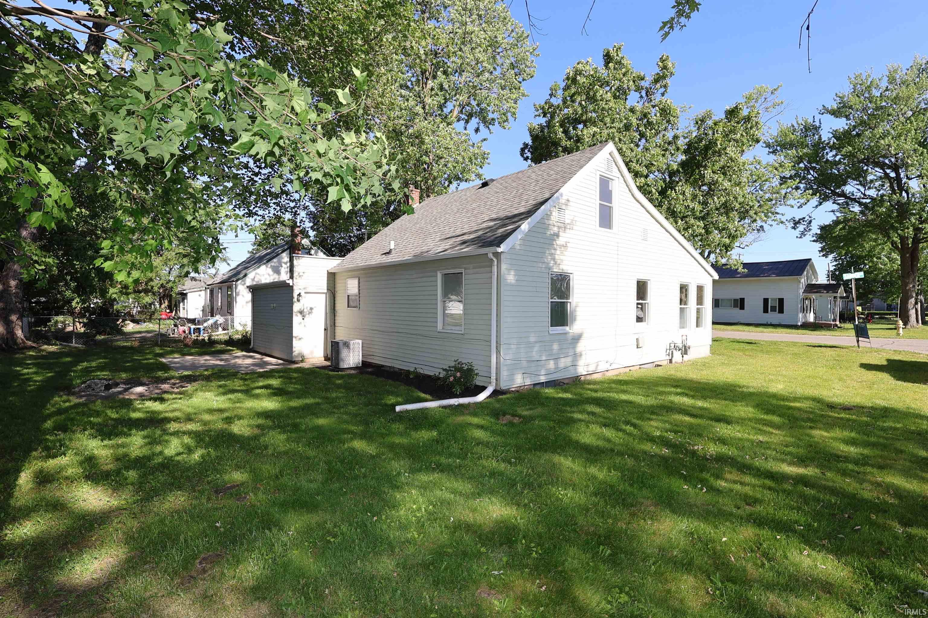 White siding exterior with a pitched roof