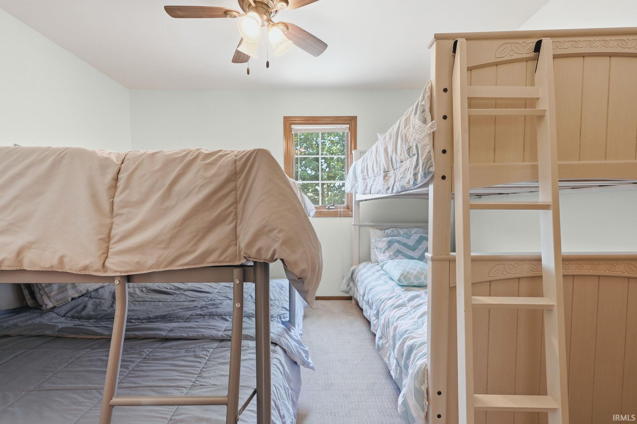 Room featuring neutral-toned walls and light-colored carpeting