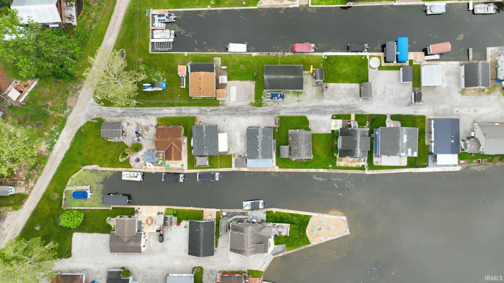 Aerial perspective revealing a waterfront community with direct canal access