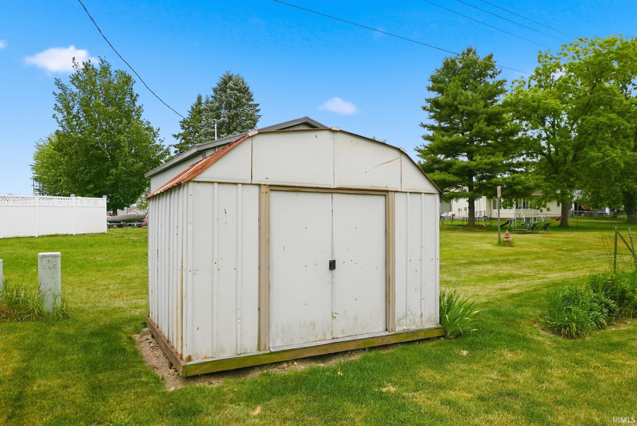 Detached metal storage shed with double doors