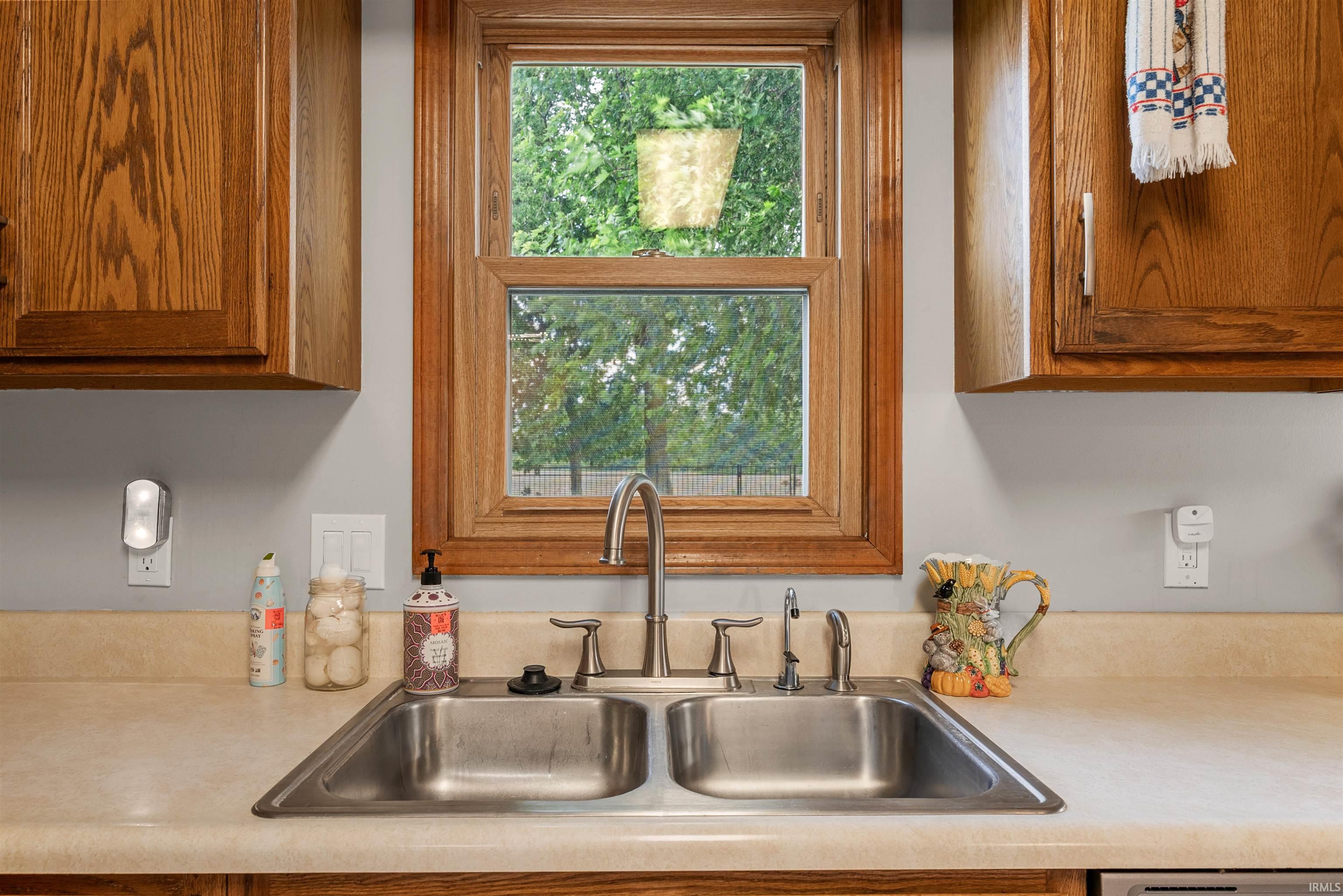 Double basin stainless steel sink with a chrome faucet