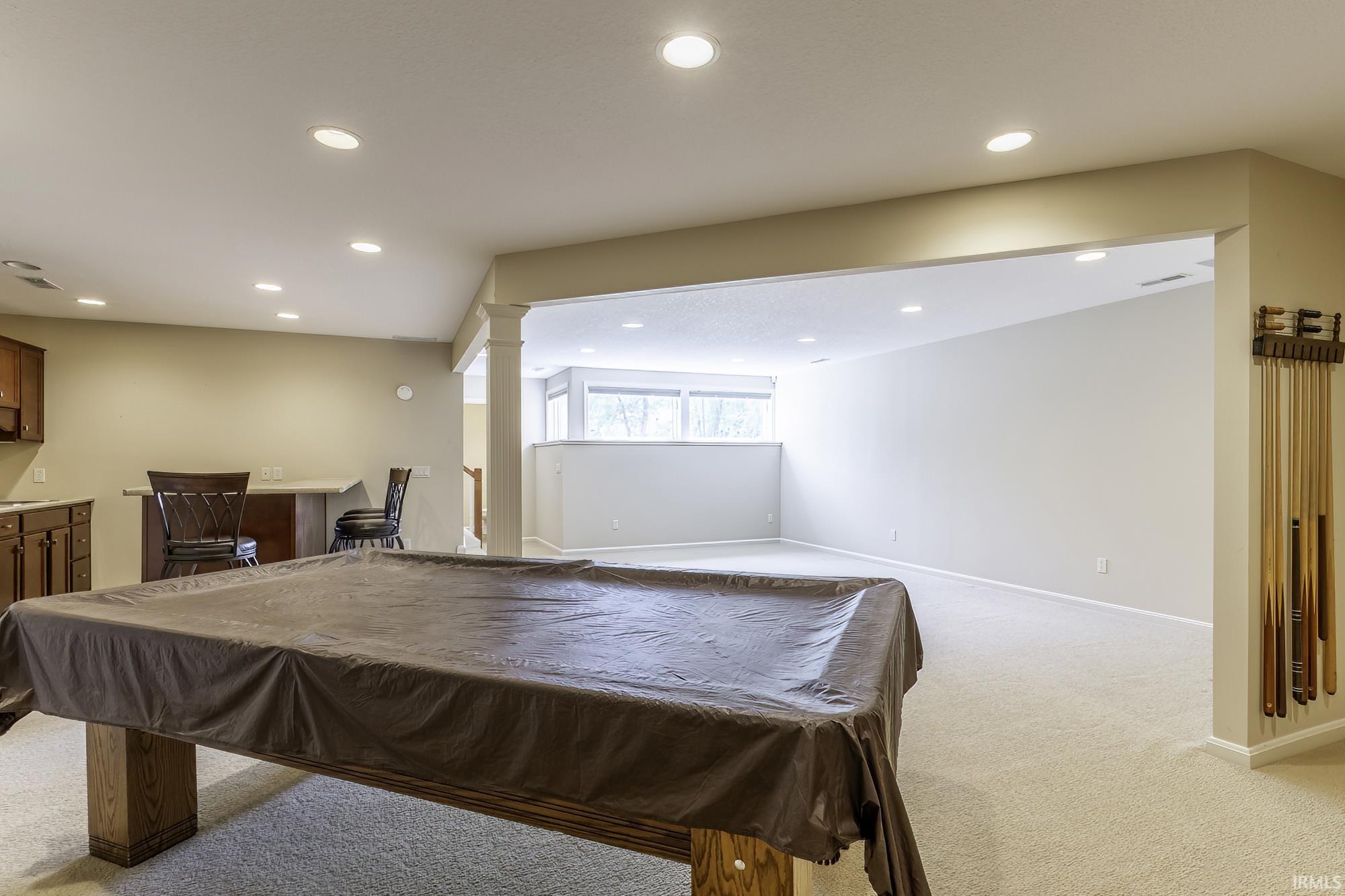 Spacious lower level featuring recessed lighting and neutral carpeting