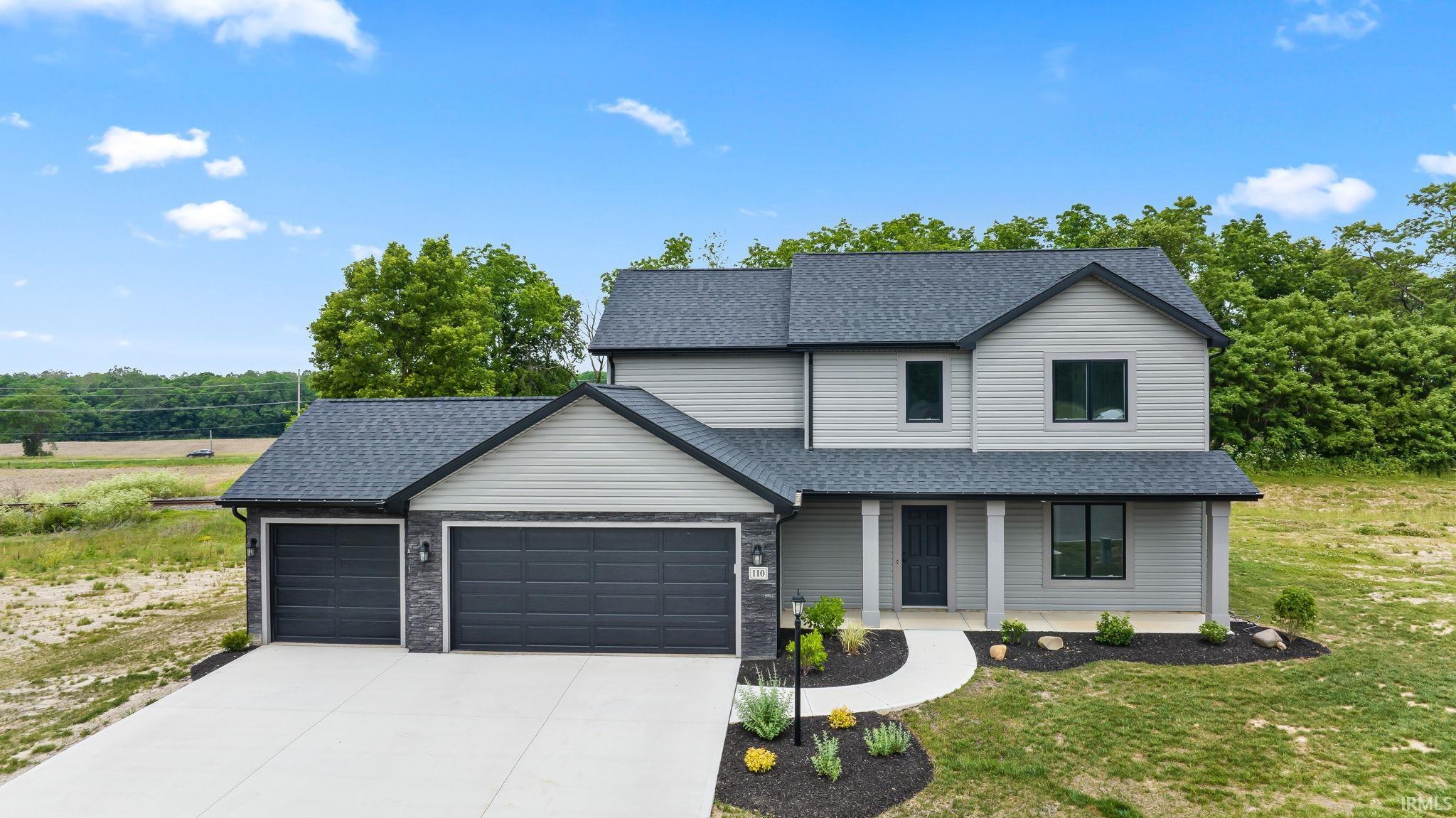 Modern two-story residence with gray siding and dark trim