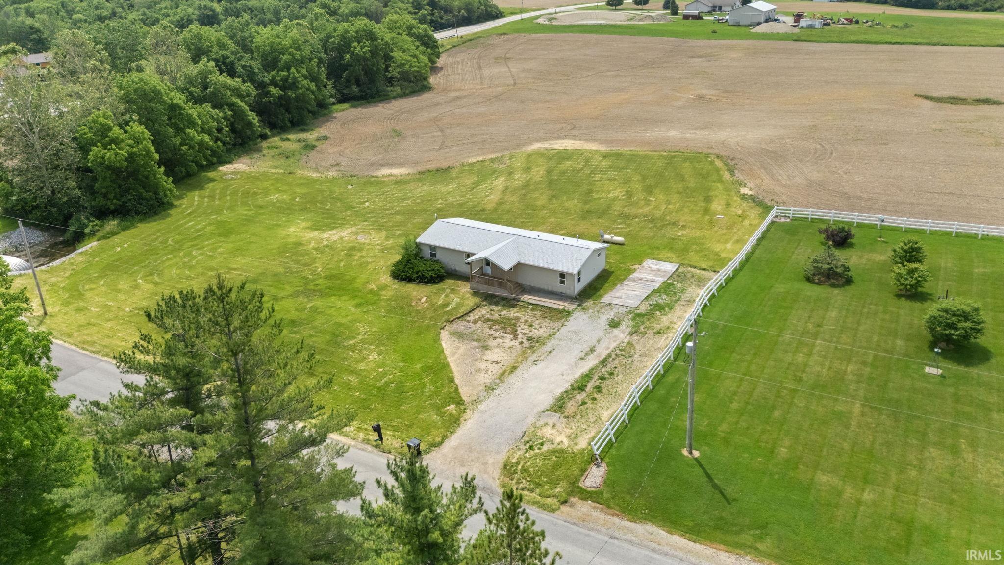 Single-story residence set on a large lot with expansive green space