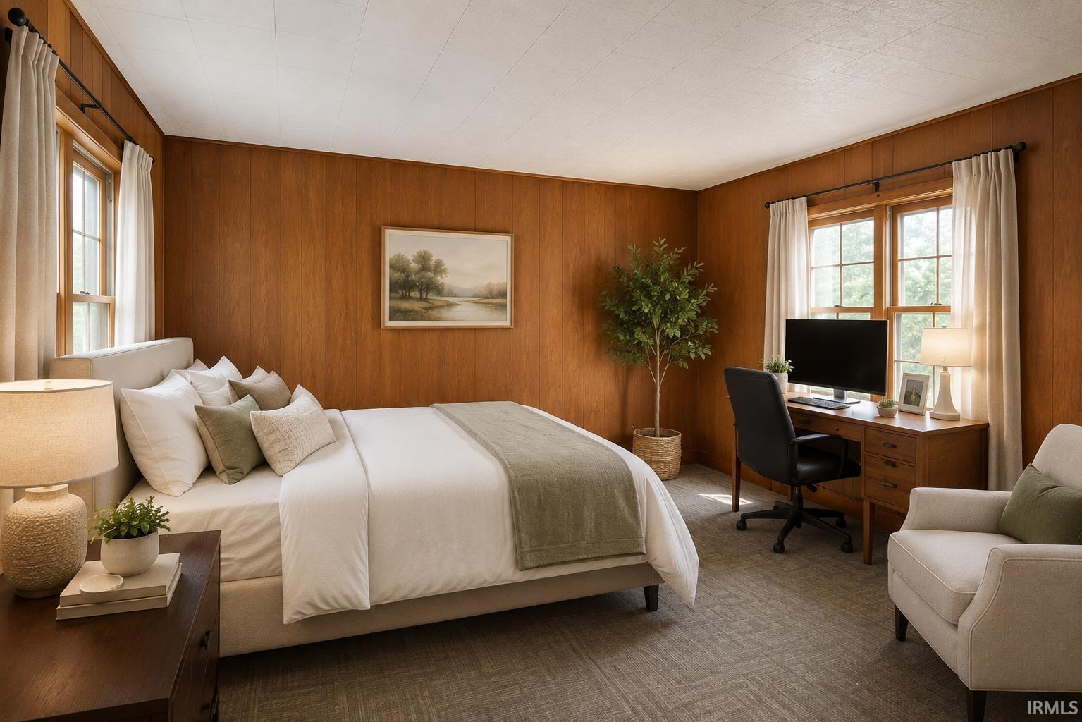 Wood-paneled room with textured carpeting, two windows, and a built-in wood desk