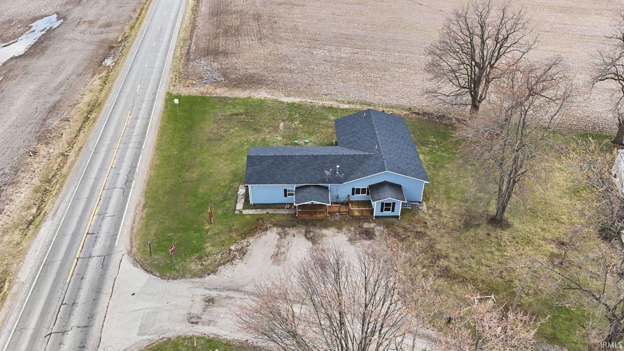 Light blue exterior with dark gray roofing