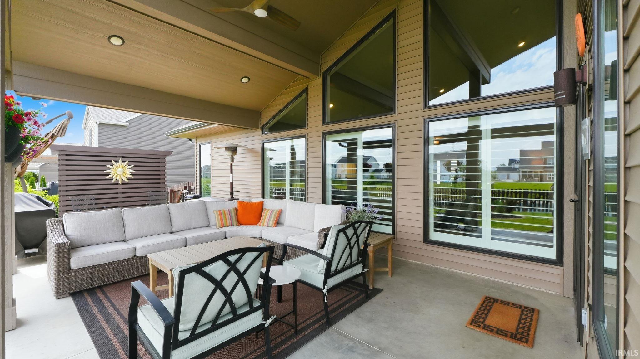 Covered patio featuring a concrete floor, recessed lighting, and a ceiling fan