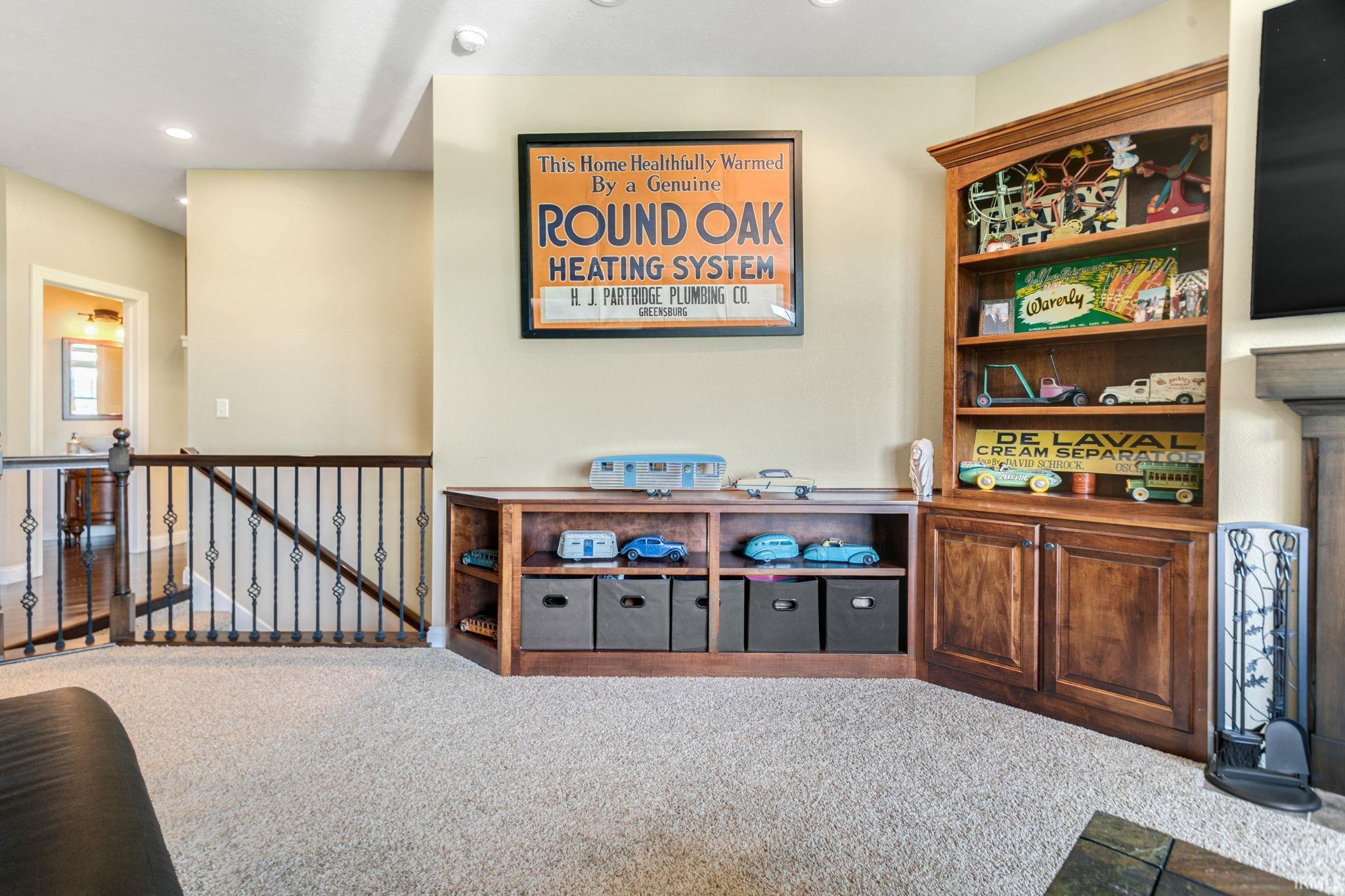 Built-in wood cabinetry with open shelving and closed storage, complemented by a wood-finish media console