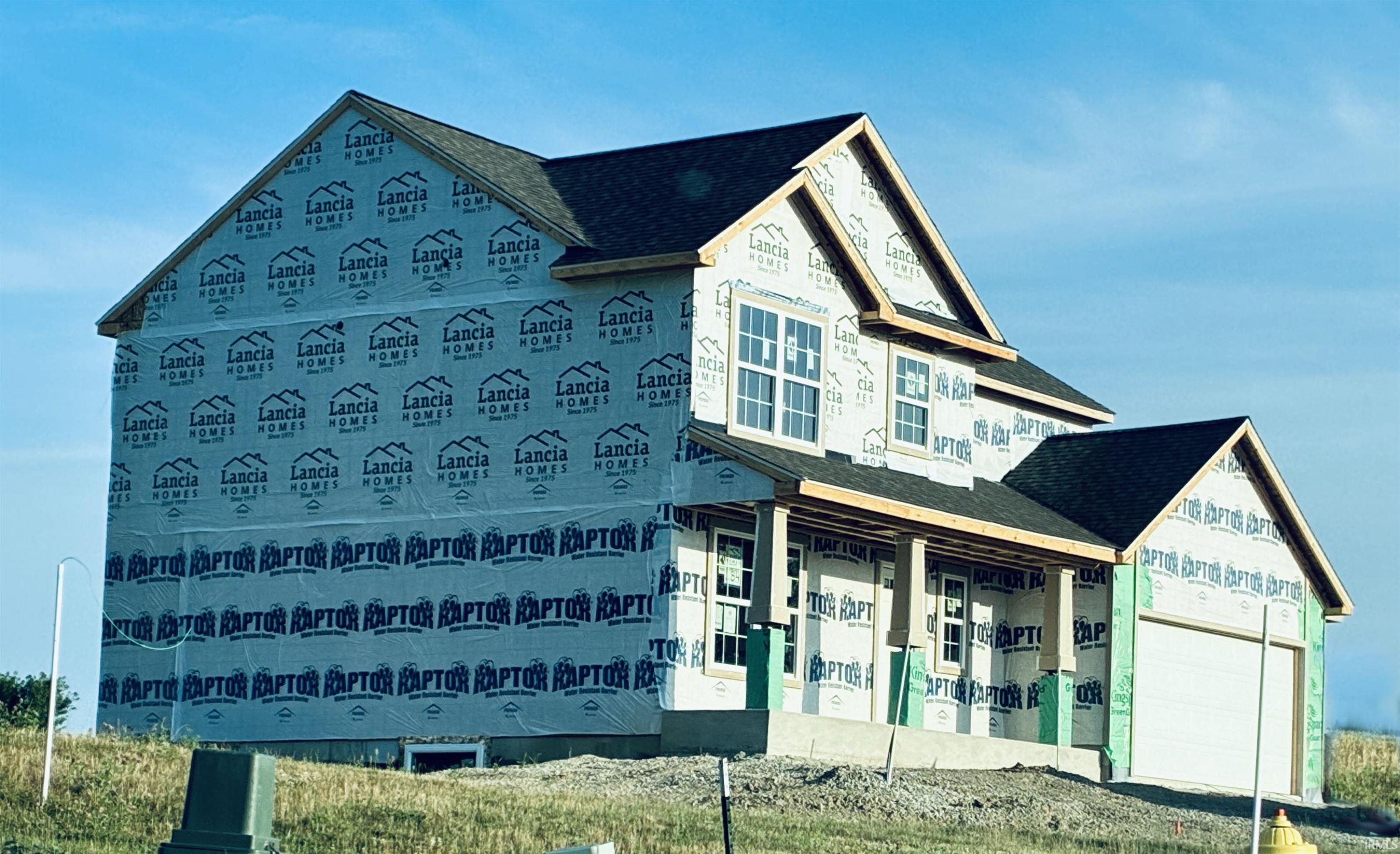 New construction residence featuring a two-story design and attached garage