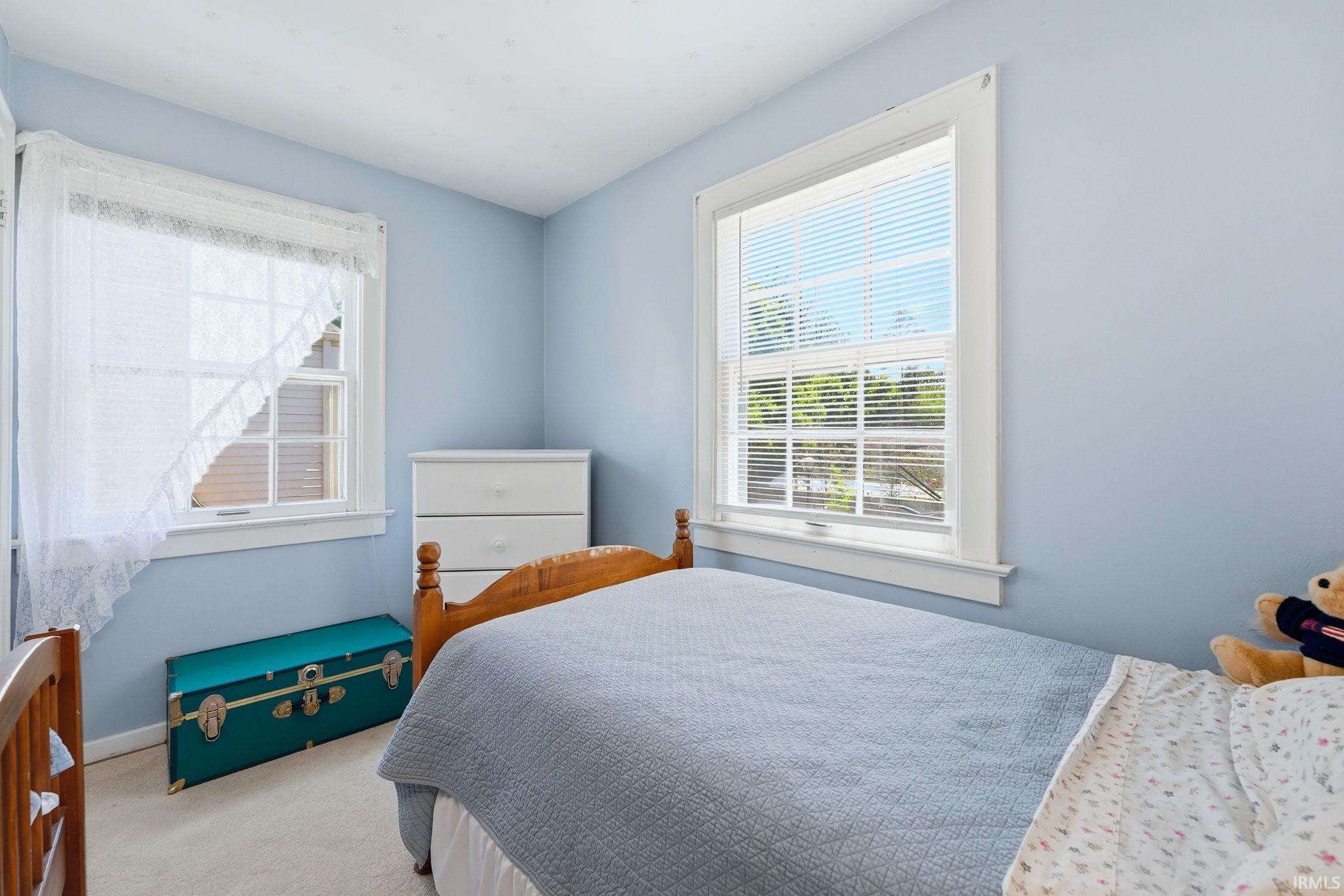 Well-lit room with two double-hung windows, offering natural light