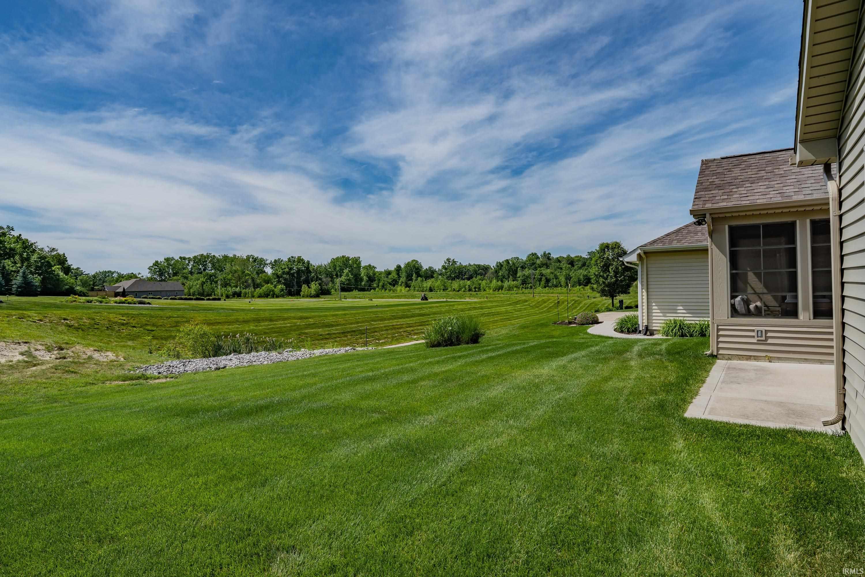 Expansive green lawn with a gentle slope
