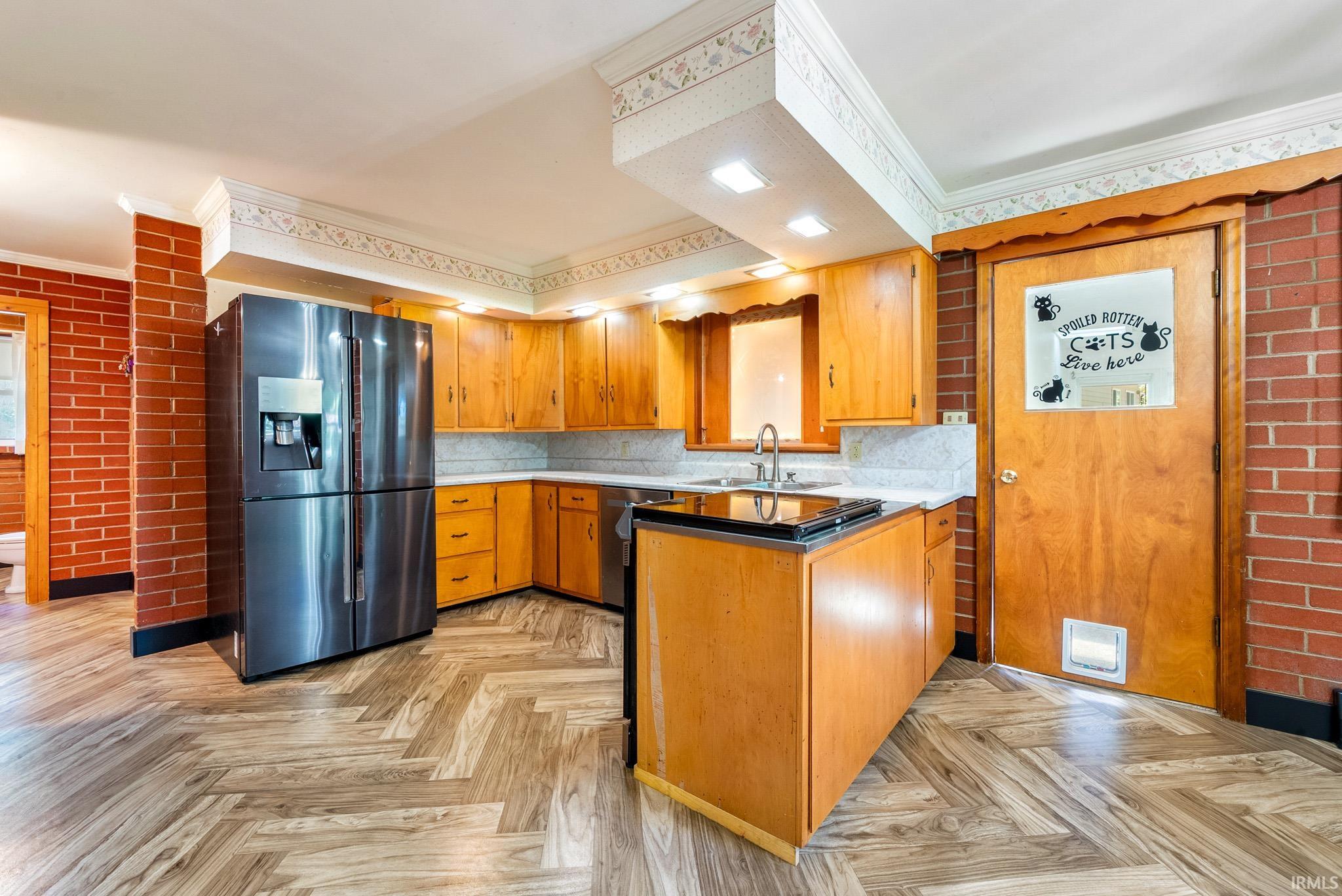 Kitchen featuring wood-finish flooring in a herringbone pattern