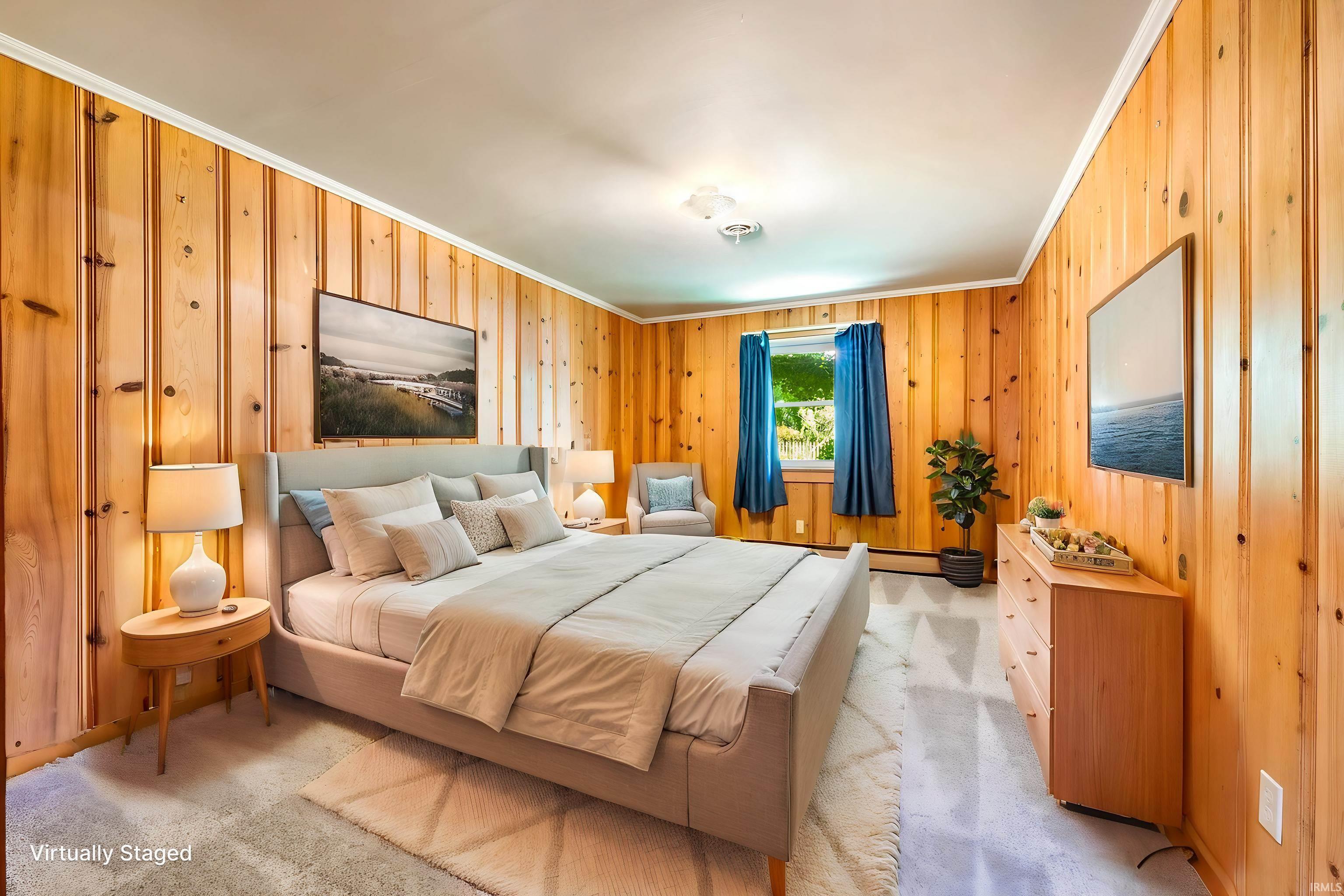 Bedroom featuring extensive wood paneling, a large window, and light-colored carpeting