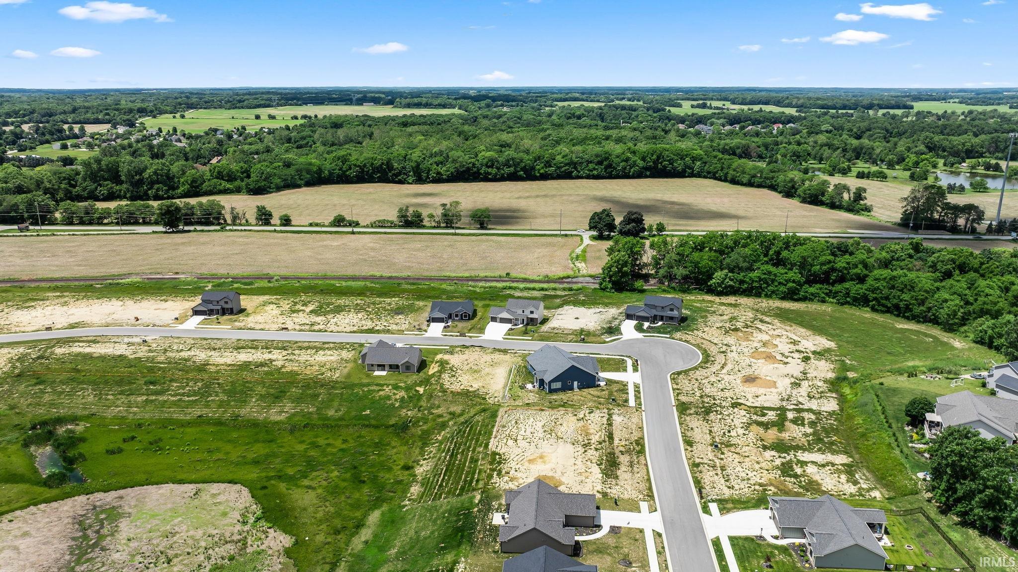 Developing residential community featuring new construction homes and paved streets