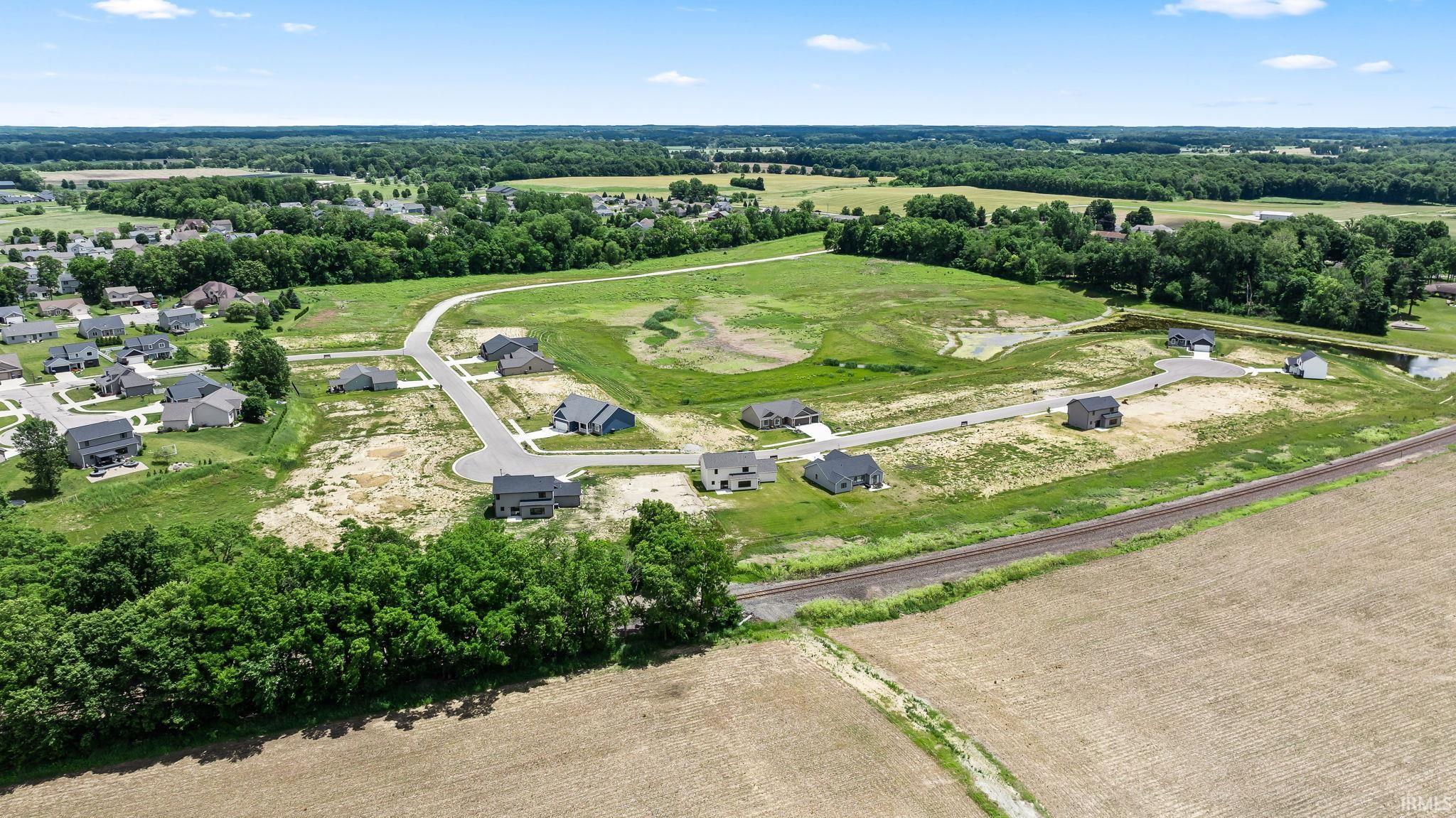 Aerial perspective of a developing residential area with newly constructed homes