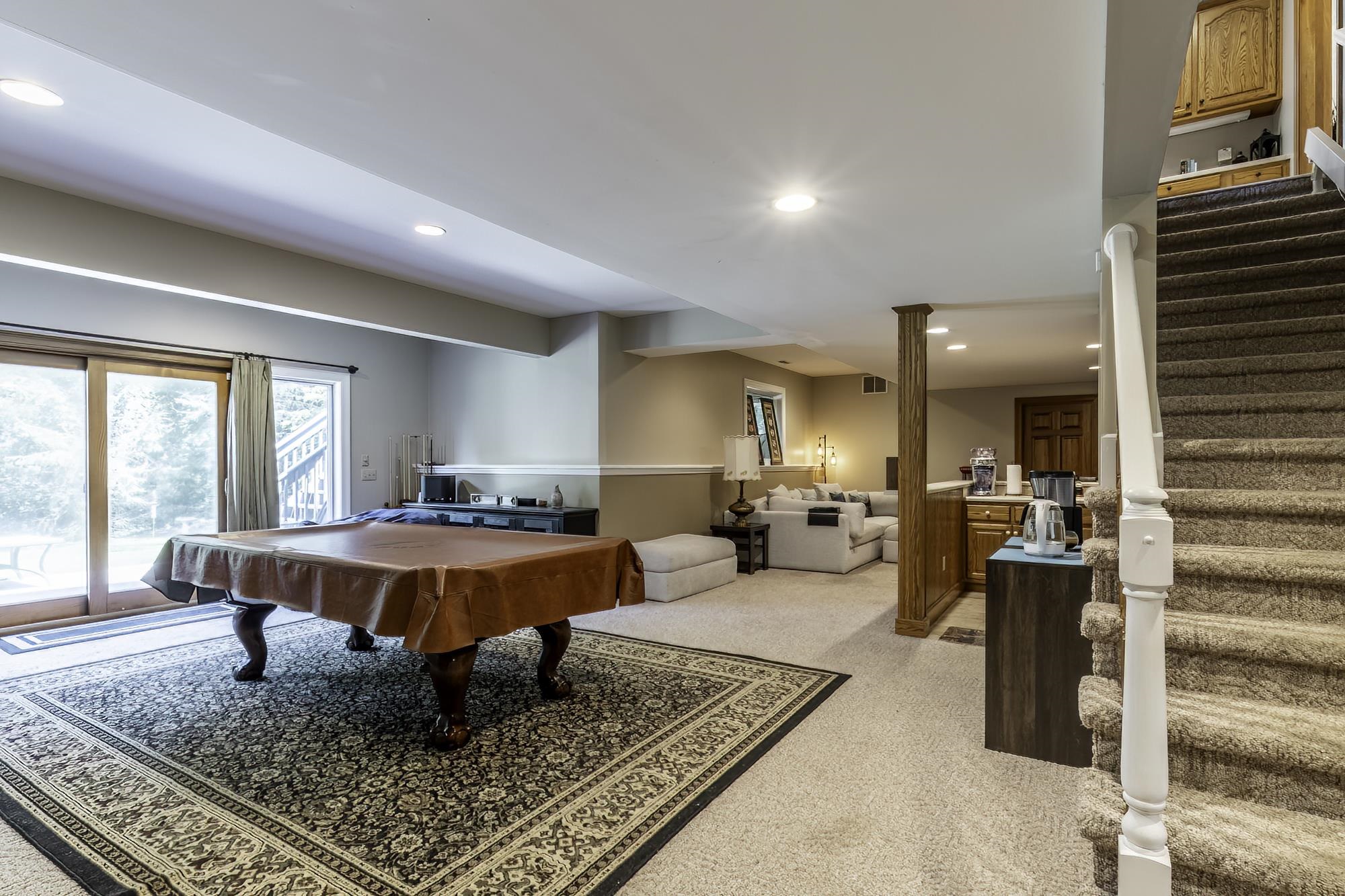 Finished lower level featuring recessed lighting and carpeted flooring