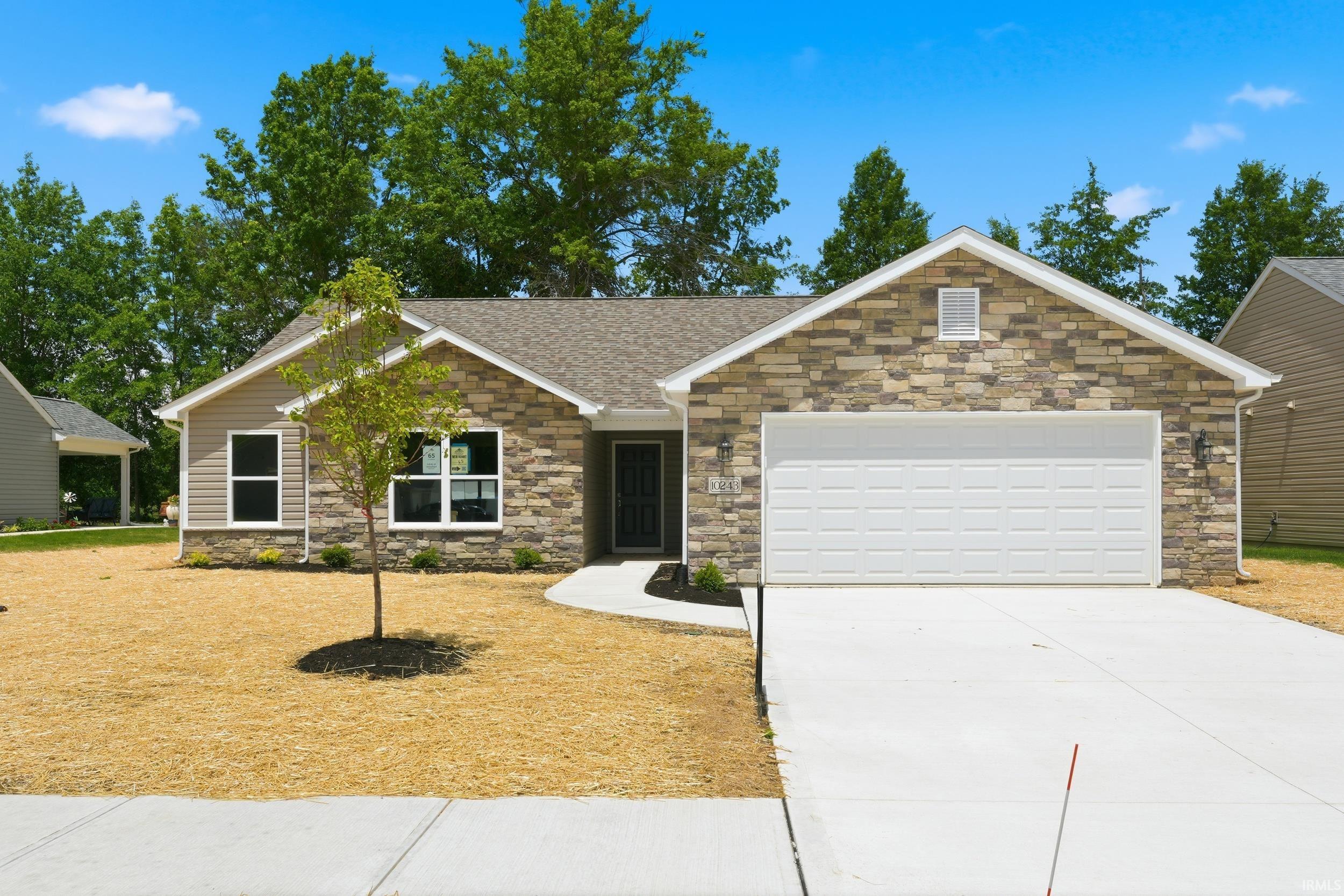 Exterior featuring stone veneer and horizontal siding