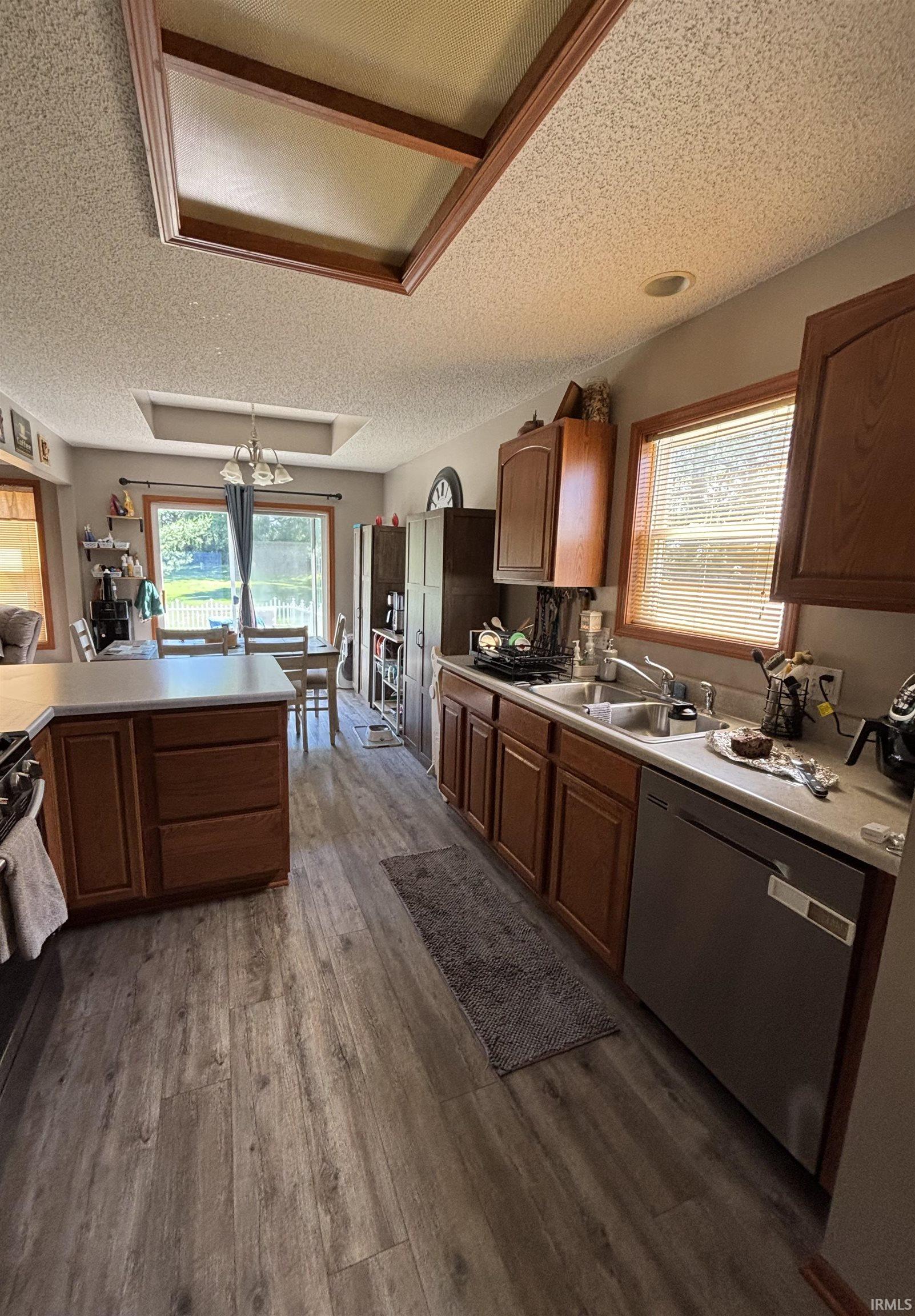 Kitchen featuring wood-finish flooring, recessed lighting, and ample cabinetry