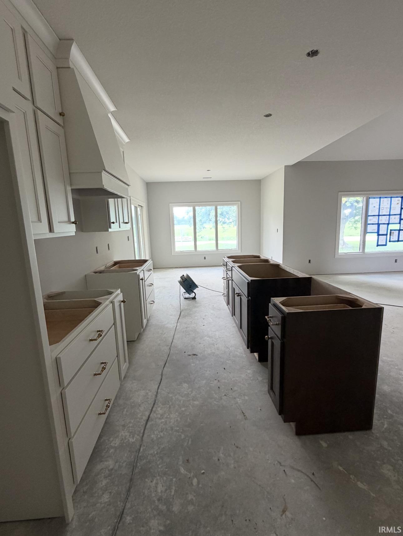 White shaker-style cabinetry with gold-tone hardware