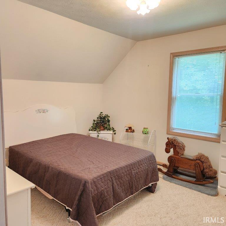 Room featuring neutral wall tones and a textured ceiling