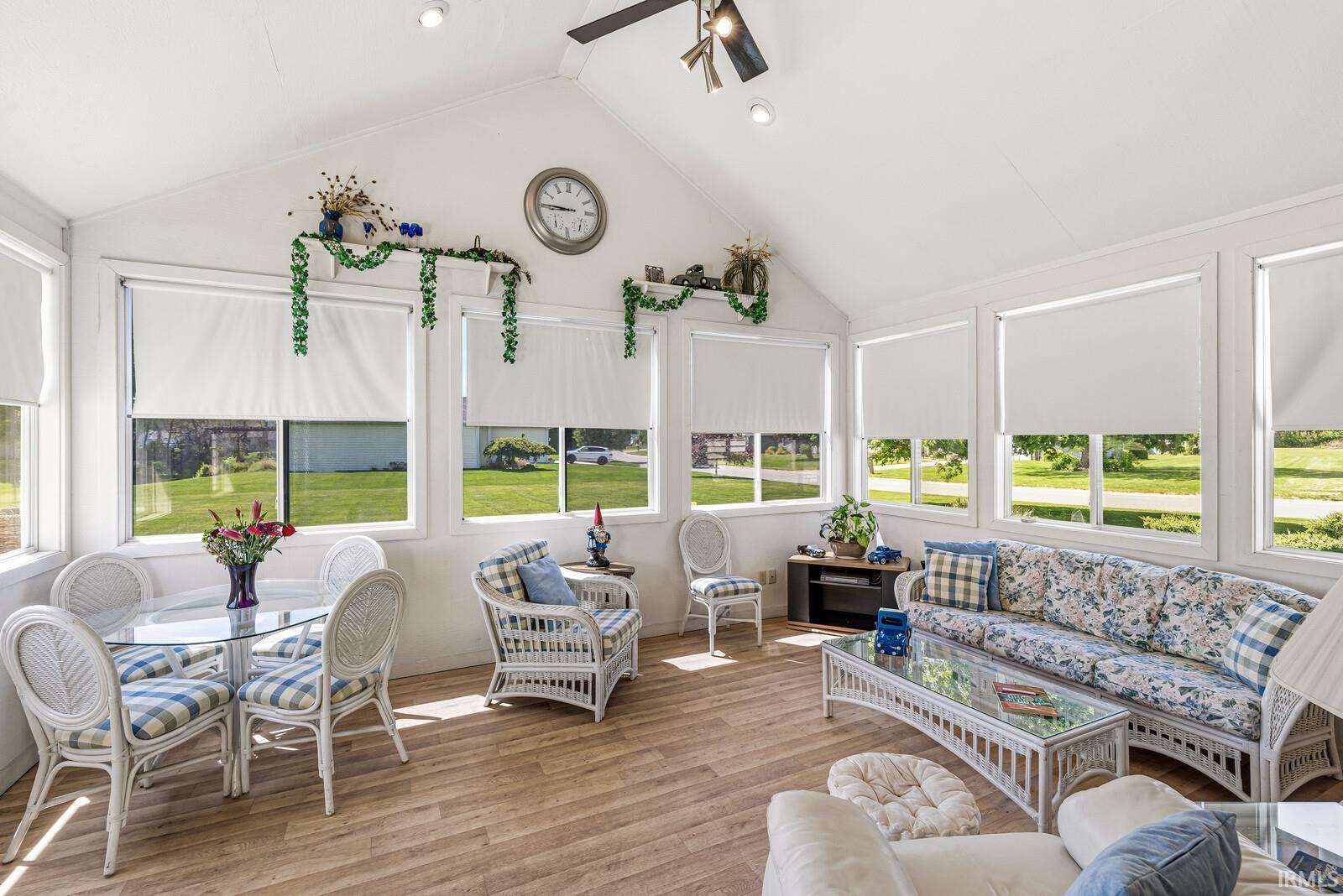 Sunroom featuring a vaulted ceiling with recessed lighting and a ceiling fan