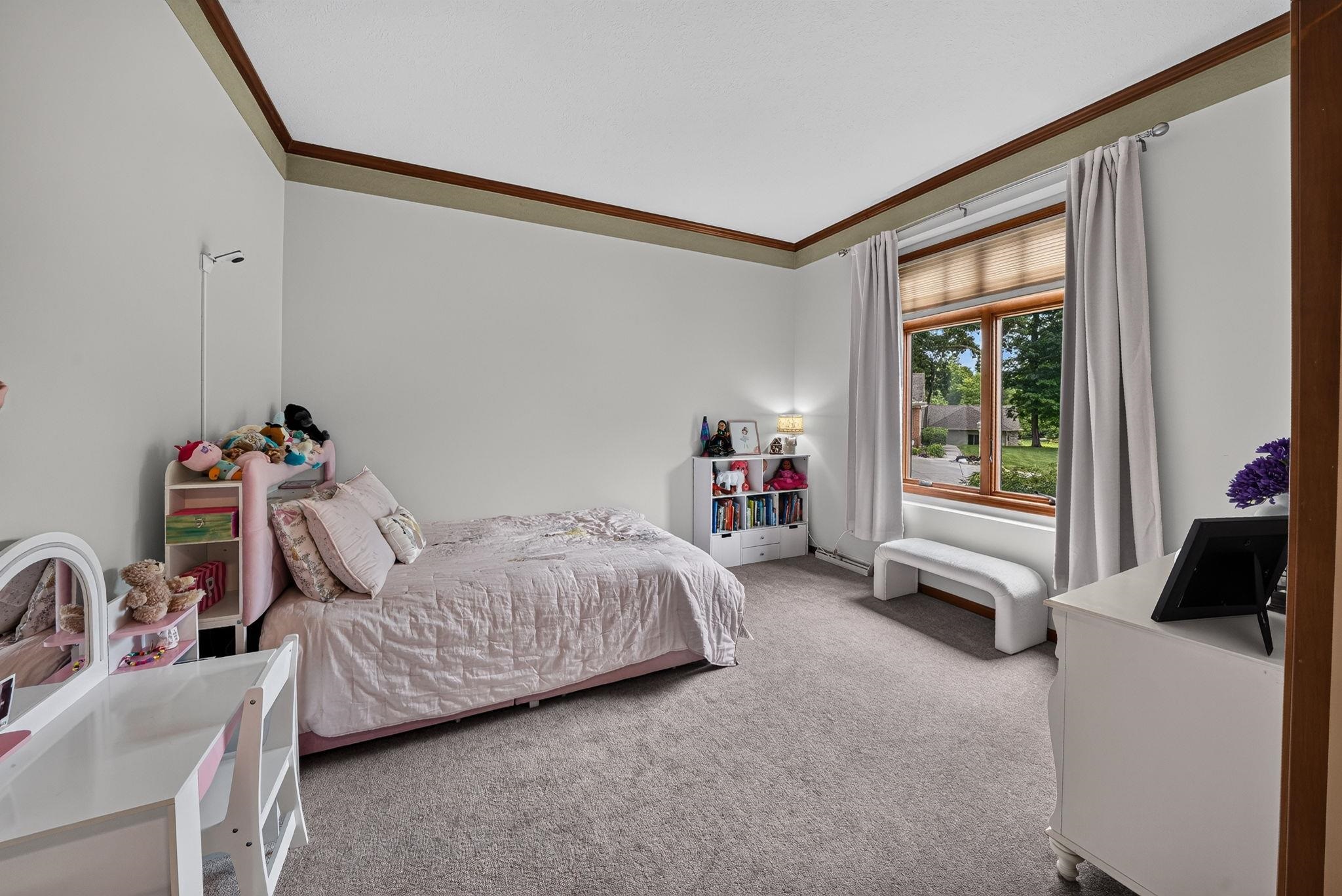Currently this room is being used as a bedroom even though there are 3 additional bedrooms upstairs.