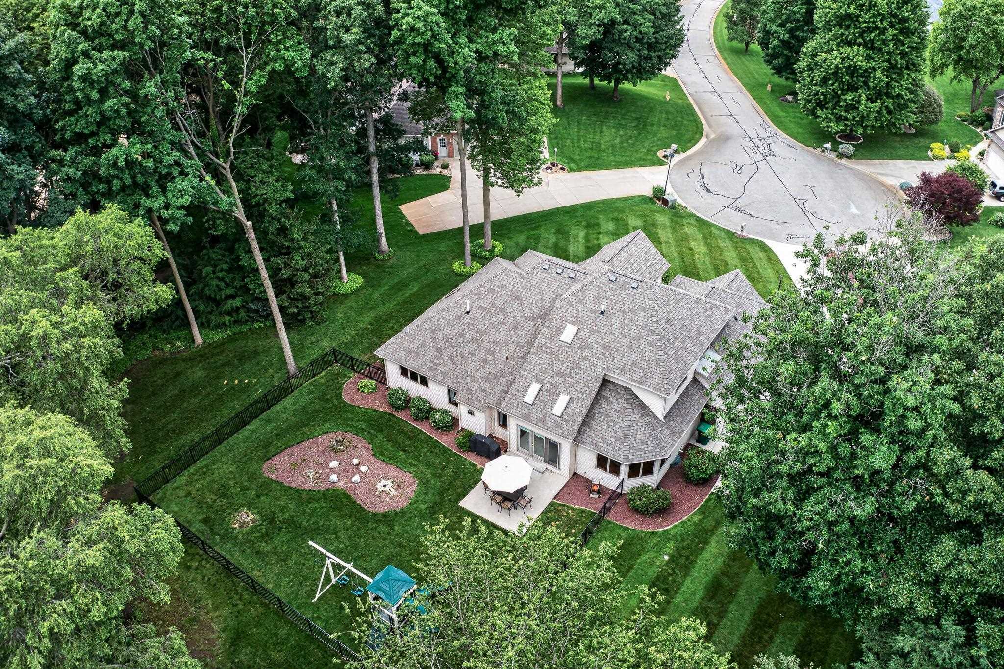 Spacious property featuring a multi-level roofline, skylights, and a private rear patio