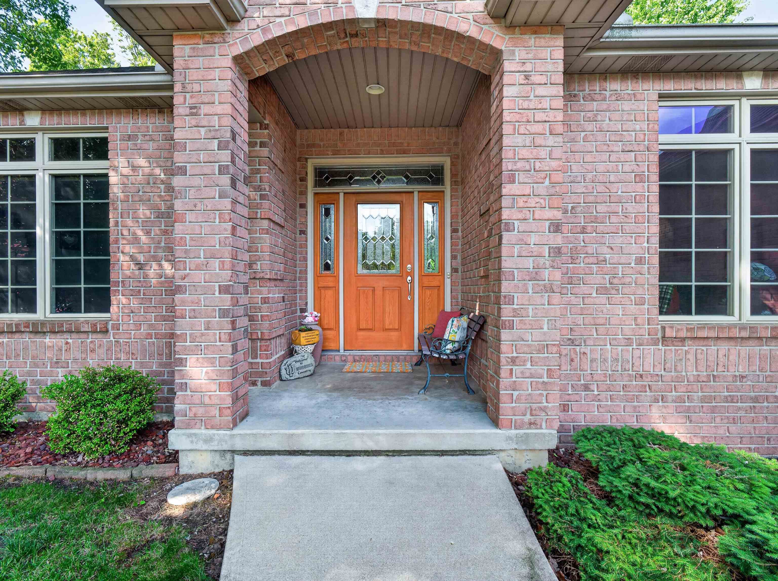 Brick facade entrance with an arched portico