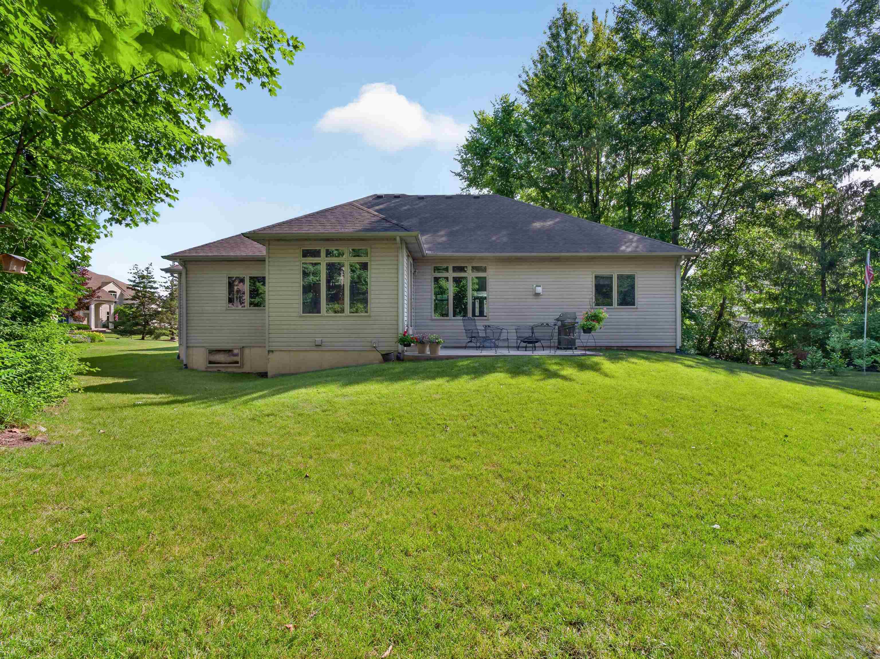 Spacious rear yard with a manicured lawn