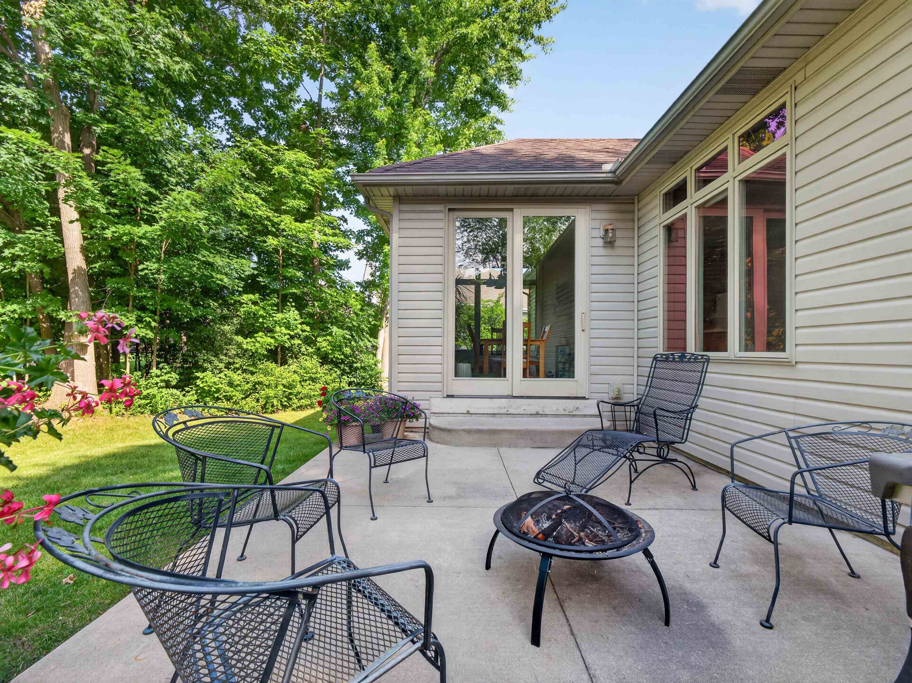 Expansive concrete patio area with direct access to interior spaces through French doors