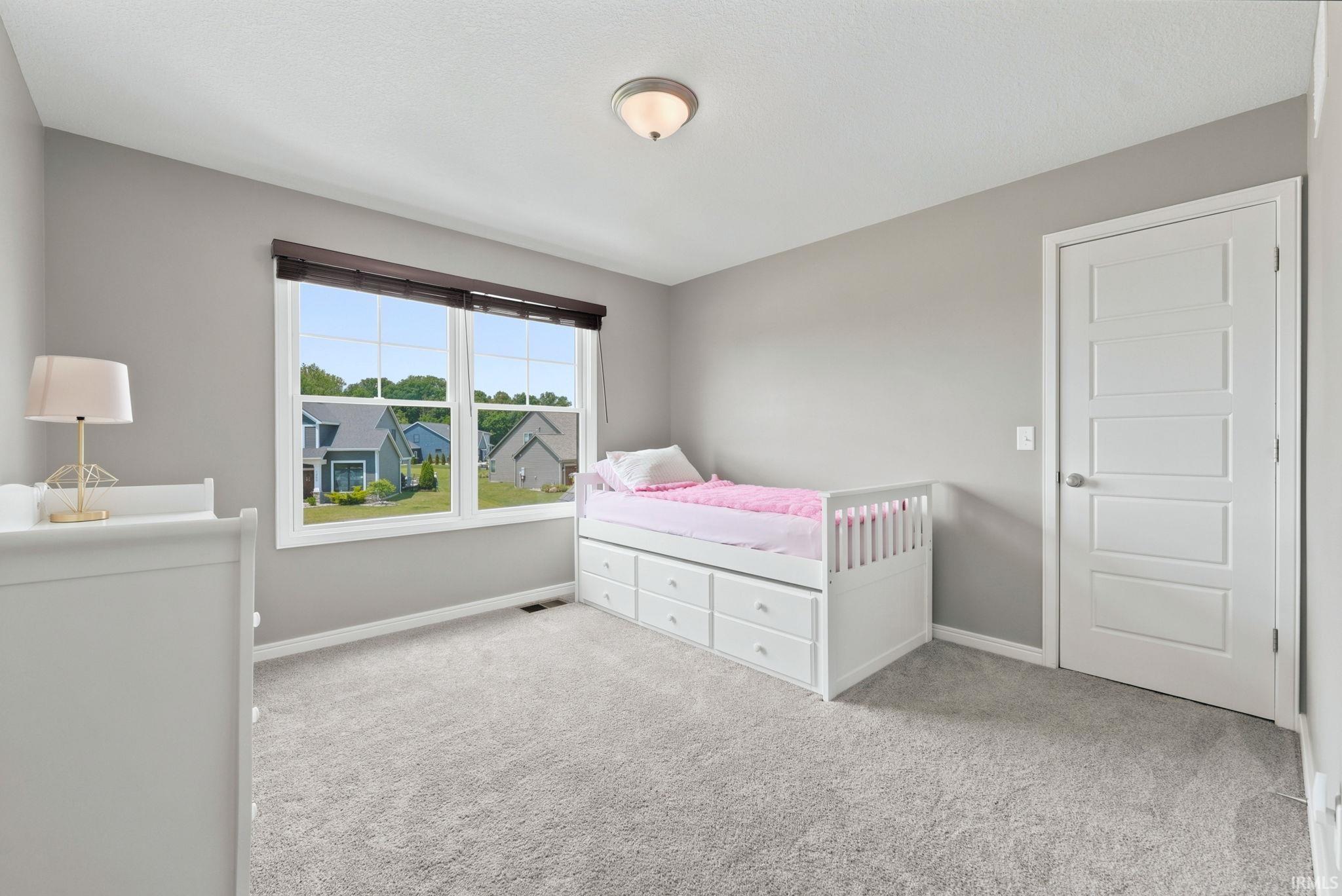 Light gray wall tones with white trim
