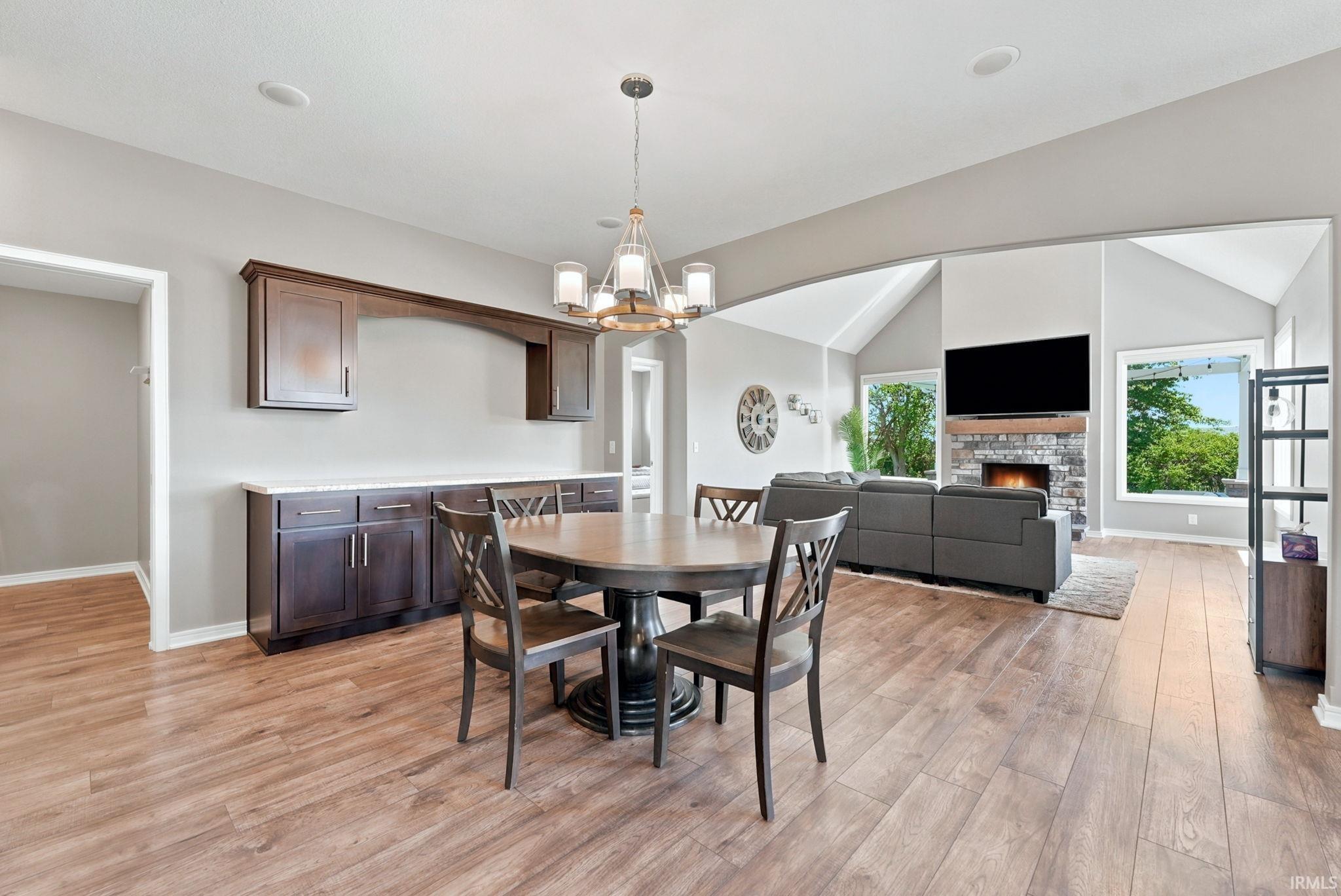 Open-concept living space with wood-finish flooring