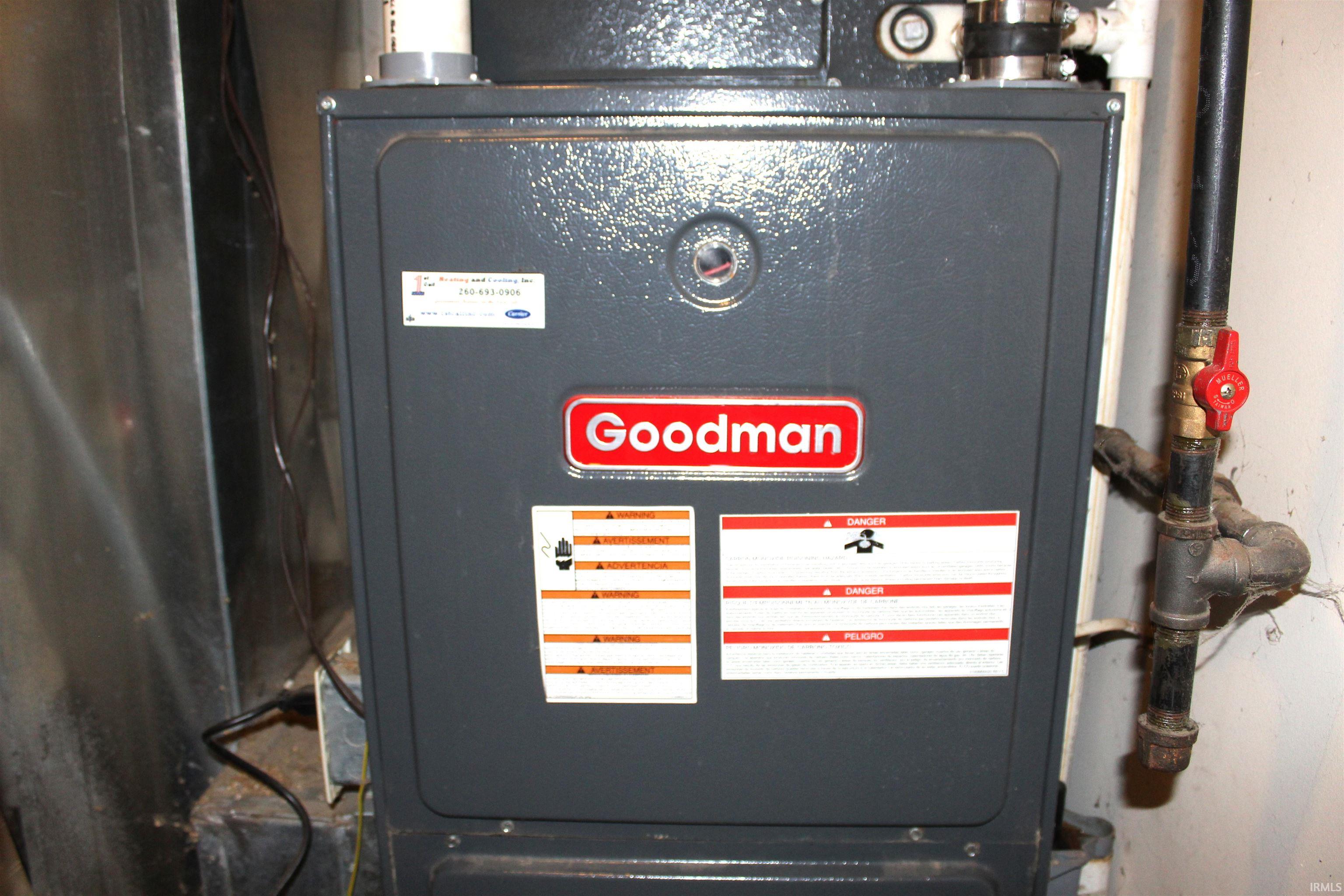 Goodman furnace unit with visible gas line and shut-off valve
