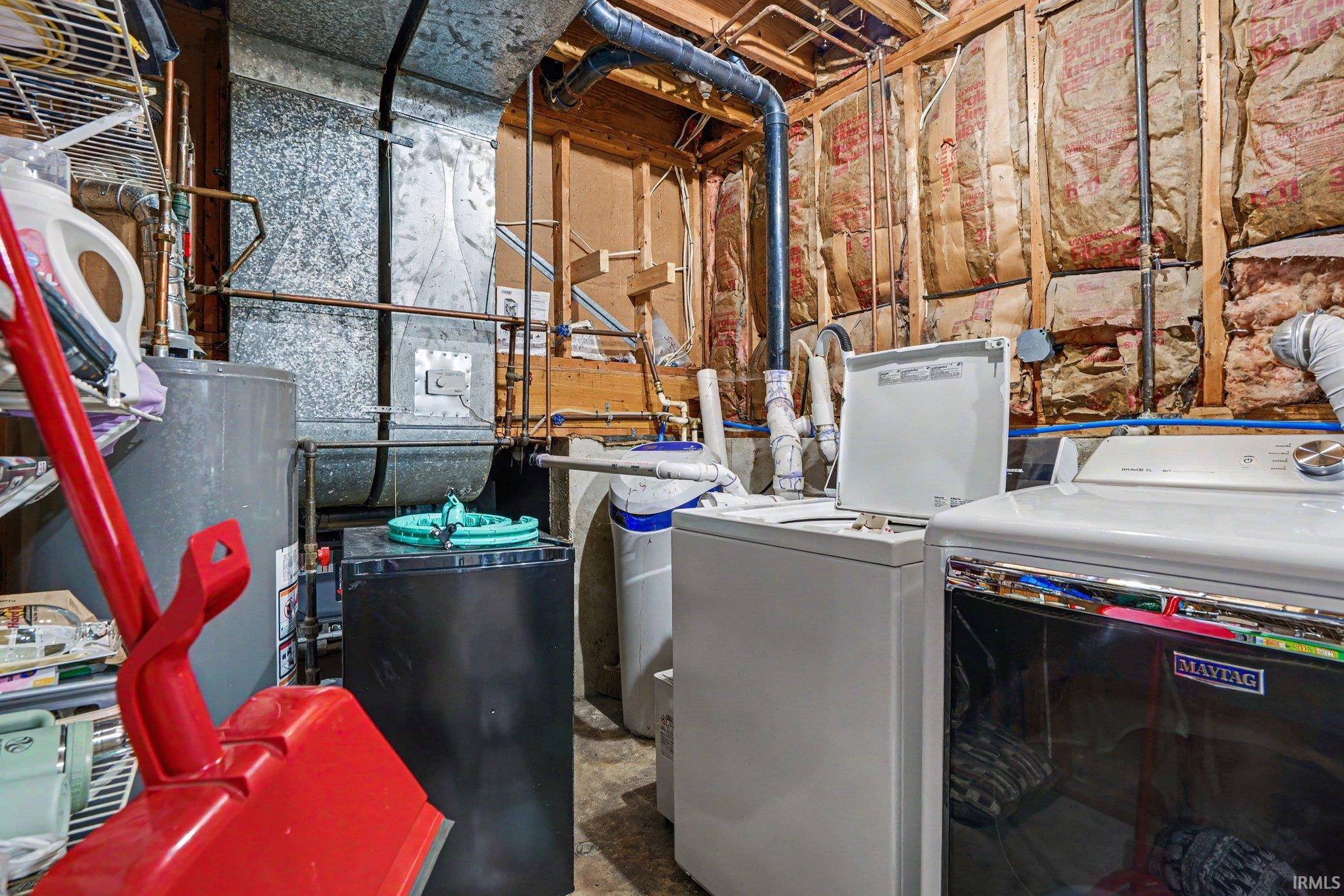 Dedicated laundry area featuring a white washing machine and a white dryer