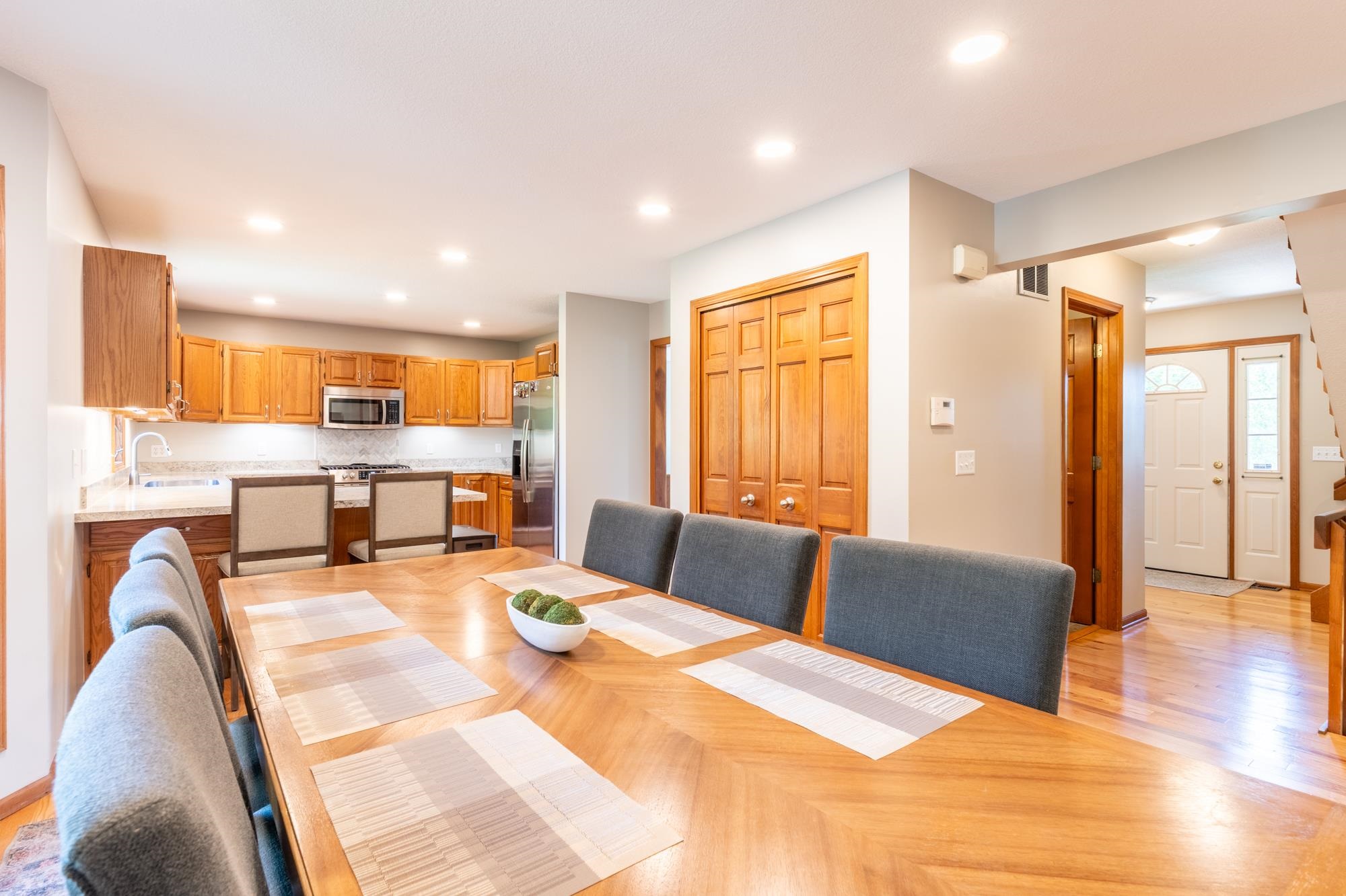 Open-concept dining area featuring wood-finish flooring