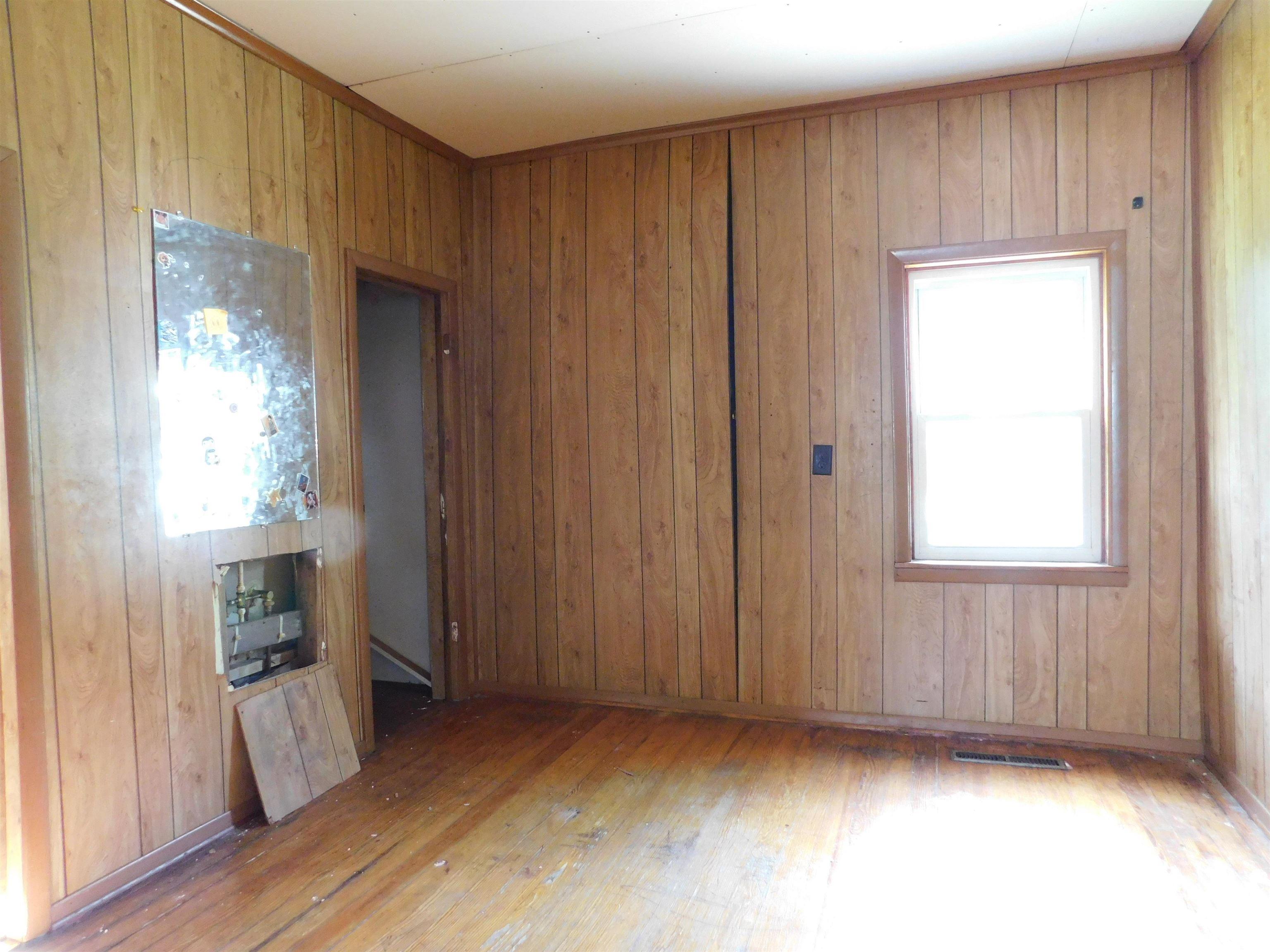 Wood-finish paneled walls with wood-finish trim