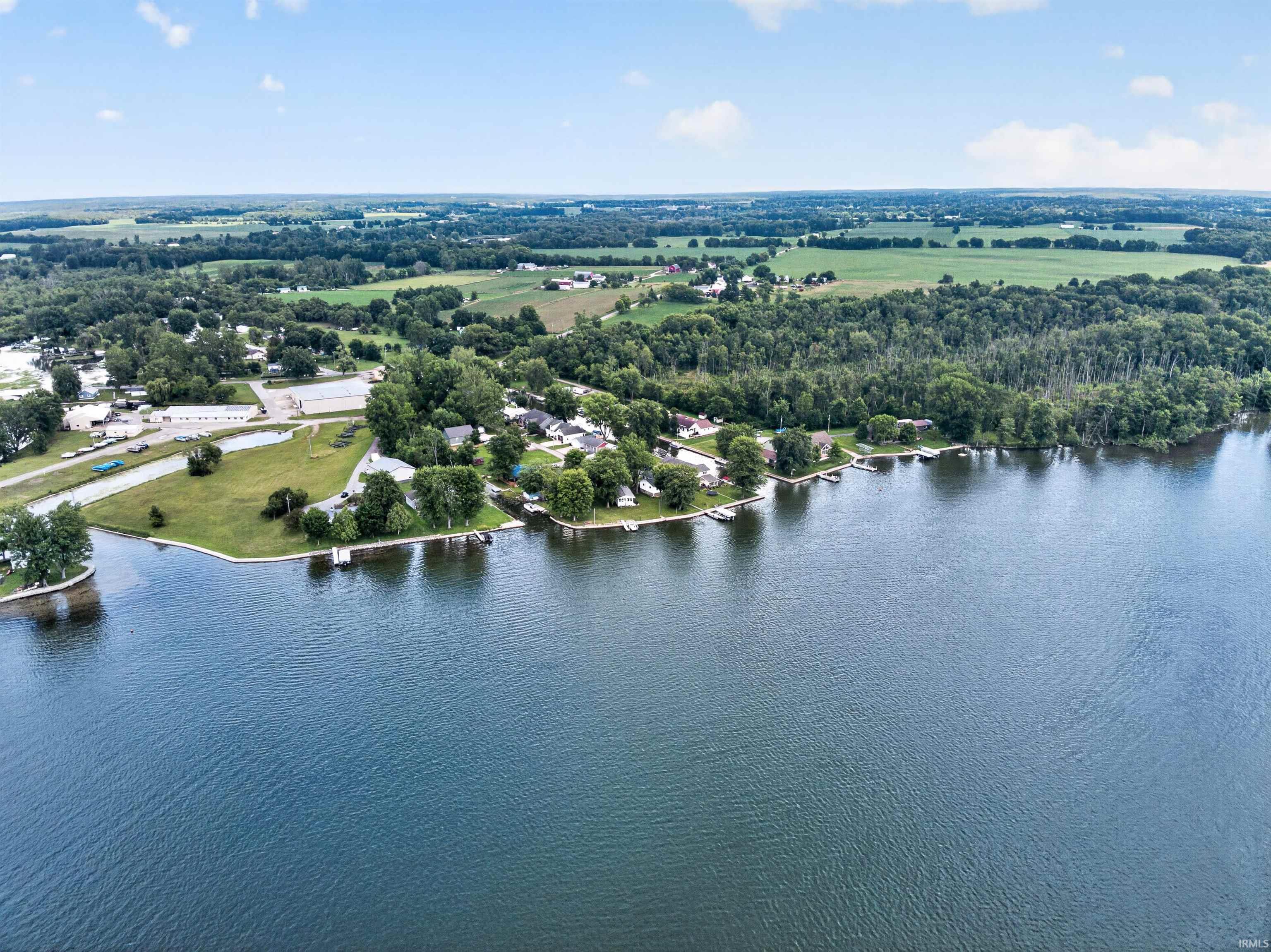 Expansive lakefront properties featuring private docks and mature trees